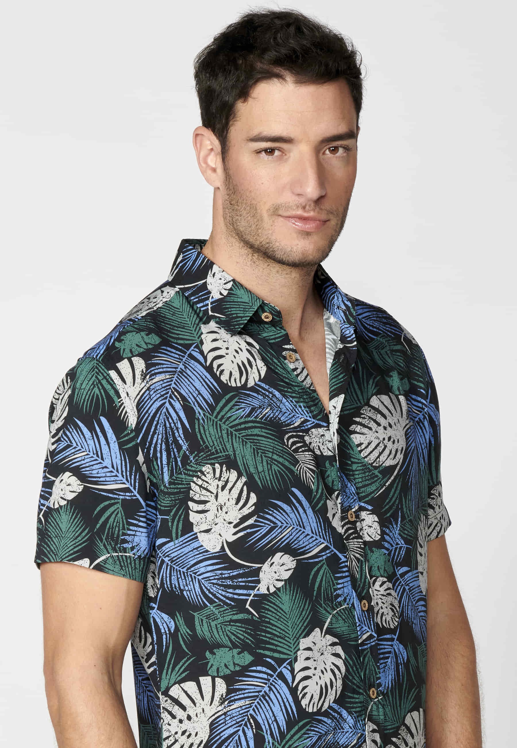 Green short-sleeved shirt with tropical print for Men