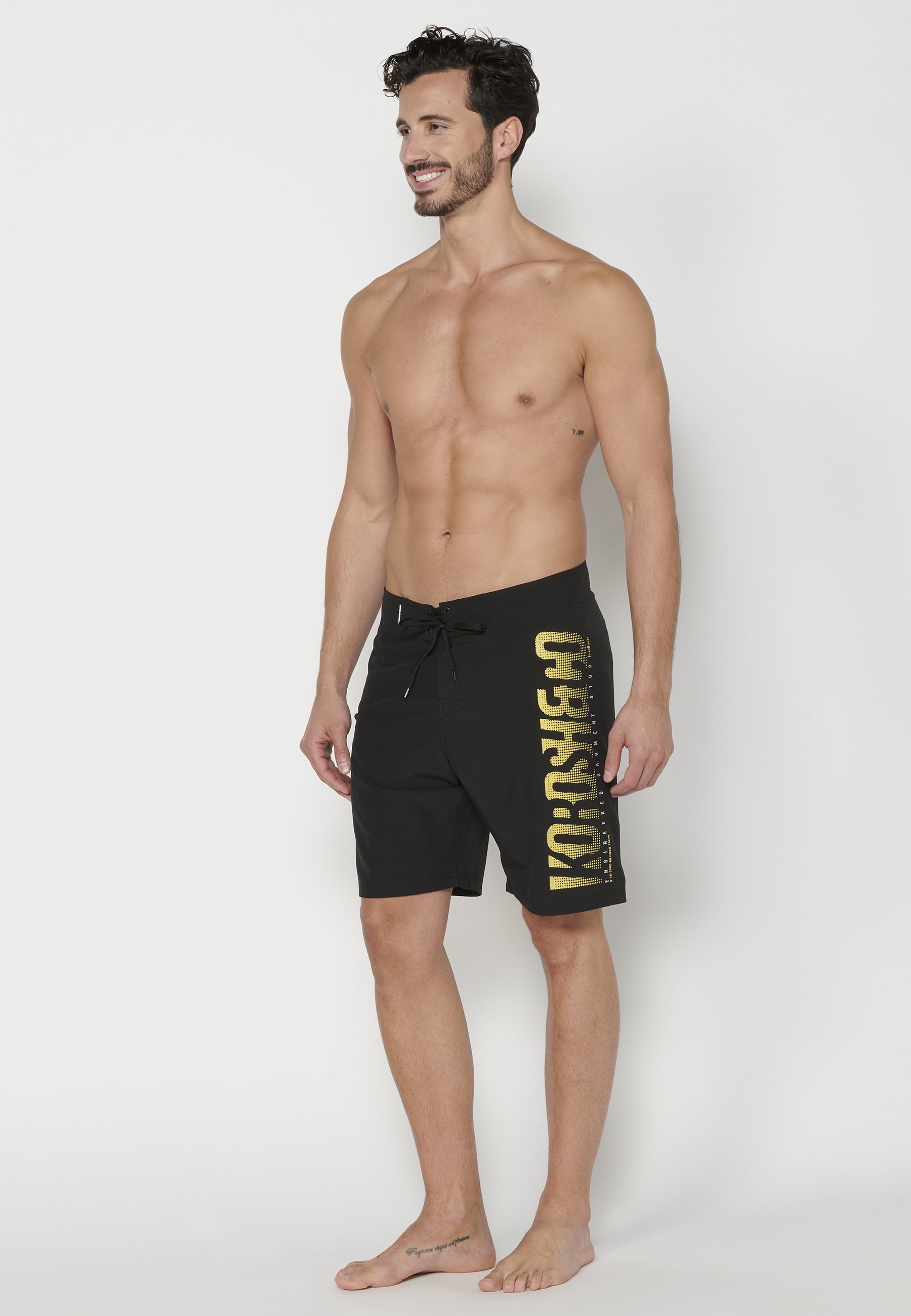 Short Surfer-style swimsuit with three Pockets in Black color for Men