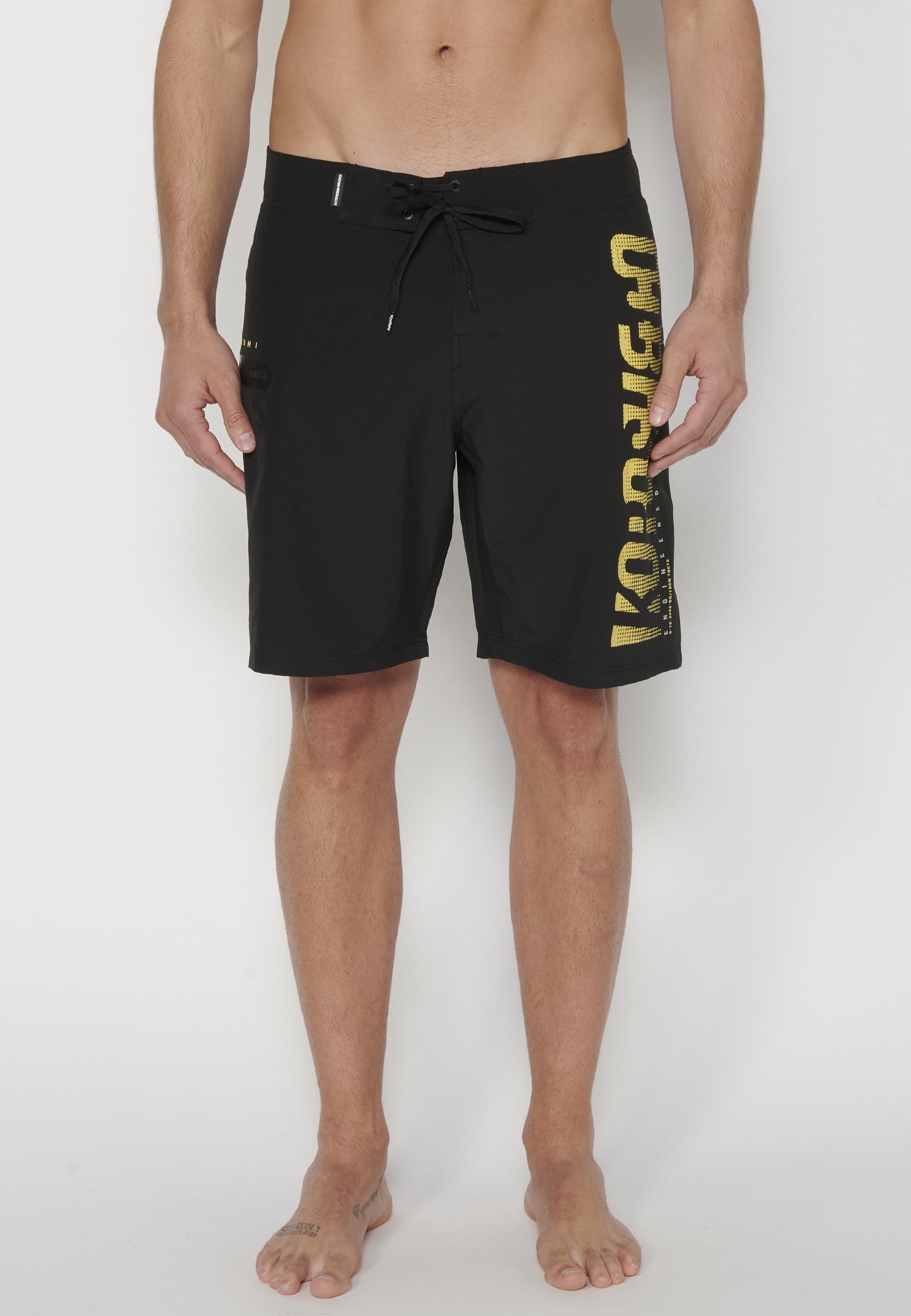 Short Surfer-style swimsuit with three Pockets in Black color for Men