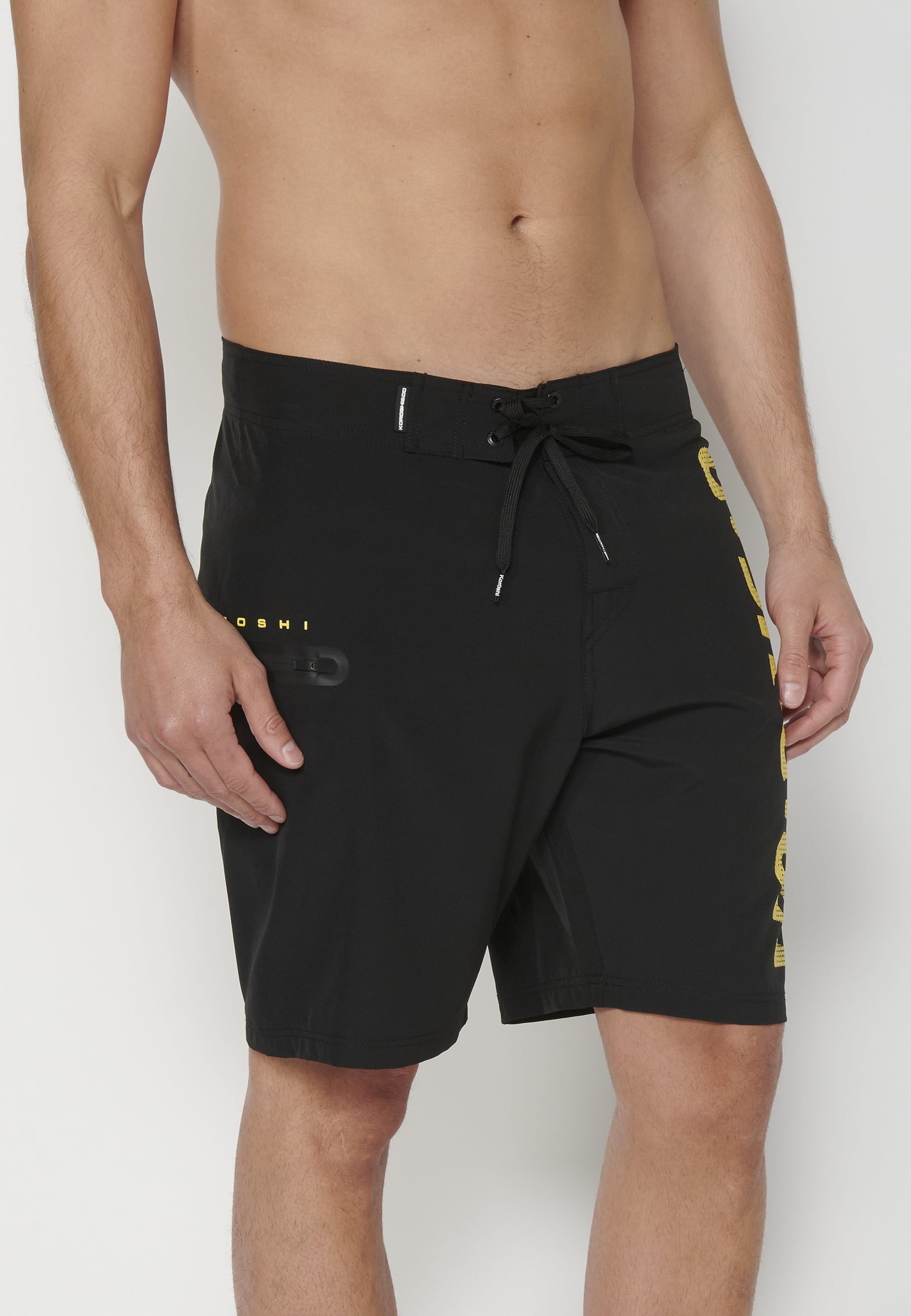 Short Surfer-style swimsuit with three Pockets in Black color for Men