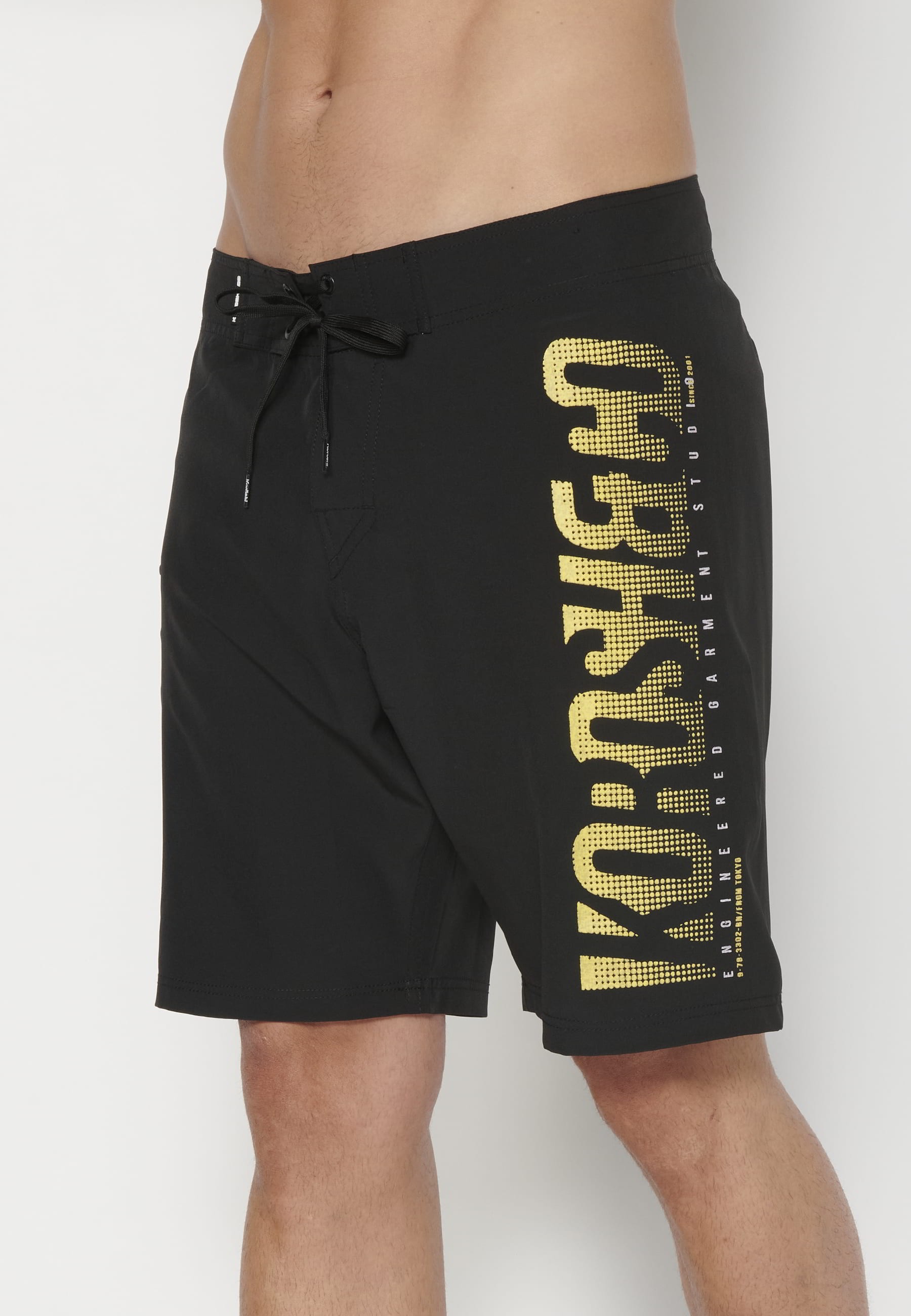 Short Surfer-style swimsuit with three Pockets in Black color for Men