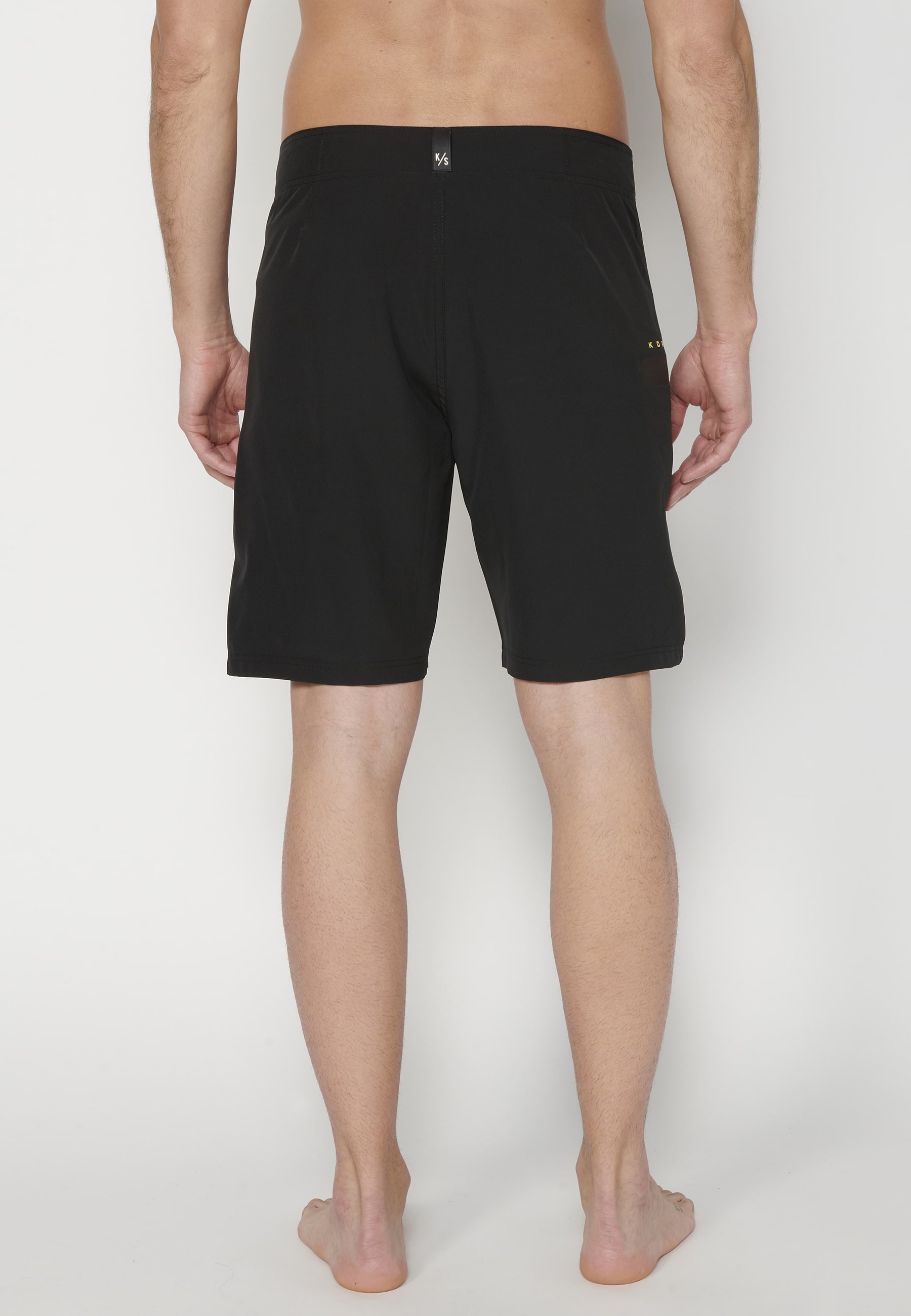 Short Surfer-style swimsuit with three Pockets in Black color for Men