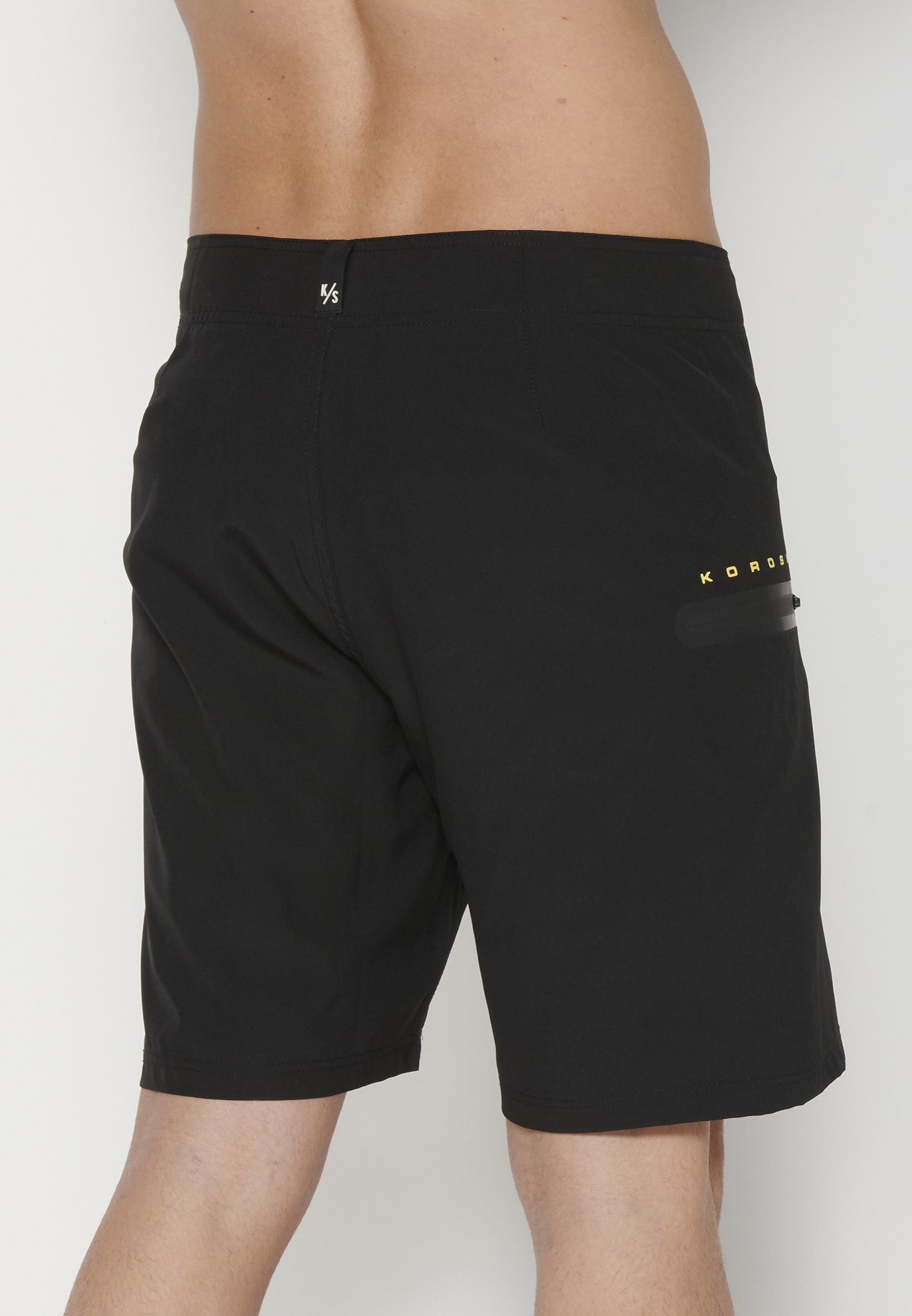 Short Surfer-style swimsuit with three Pockets in Black color for Men