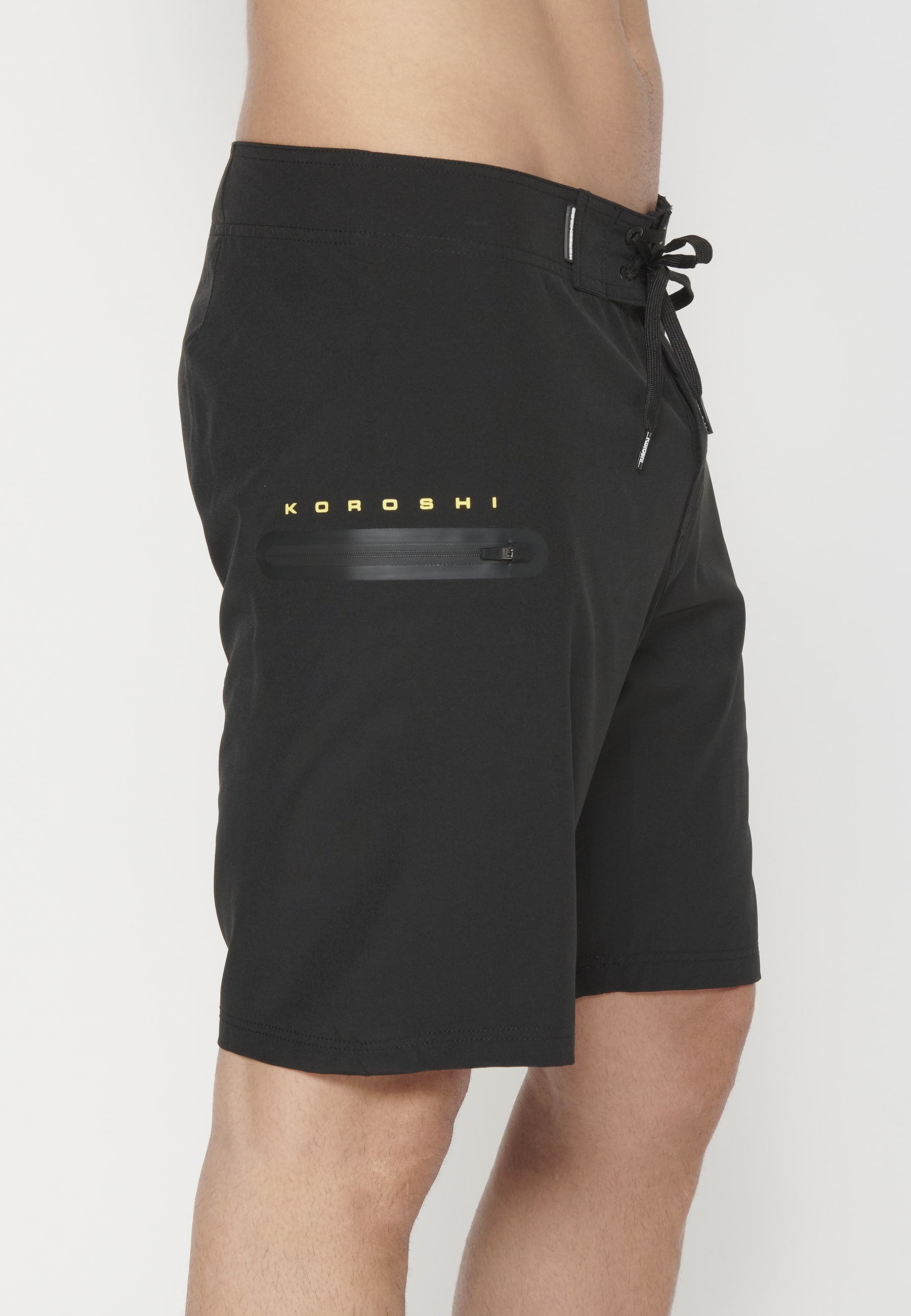 Short Surfer-style swimsuit with three Pockets in Black color for Men