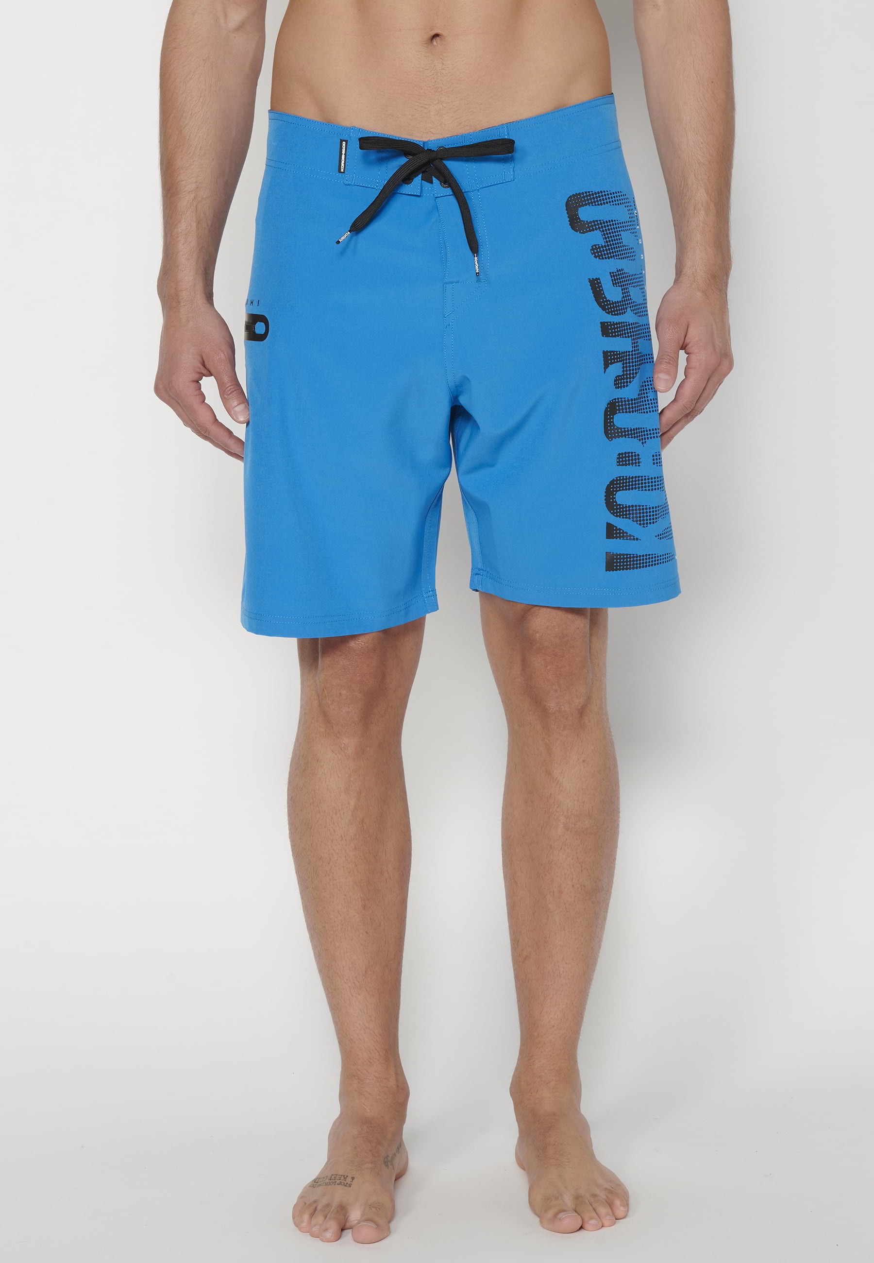 Short Surfer-style swimsuit with three Pockets in Blue color for Men