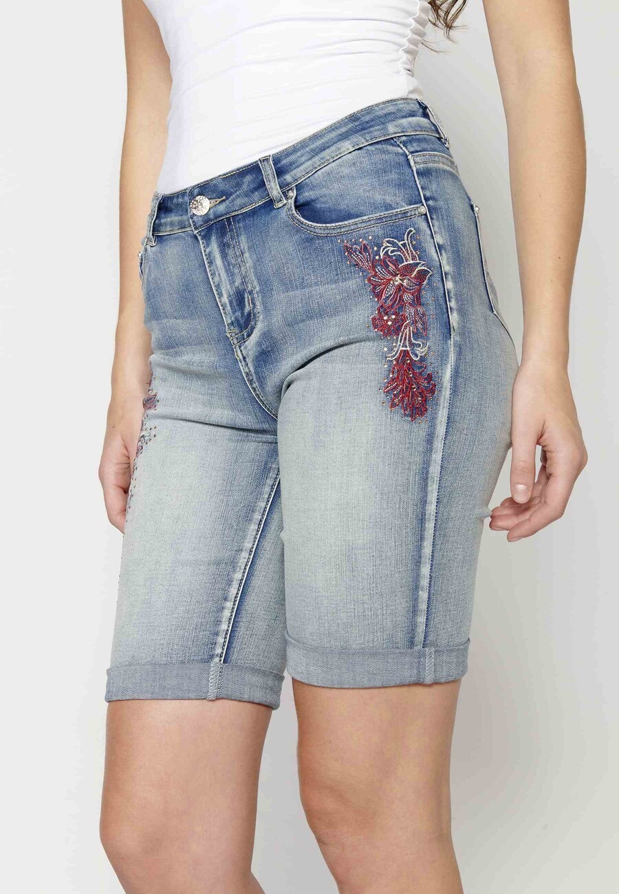 Blue slim-fit shorts with floral embroidery for Woman 6