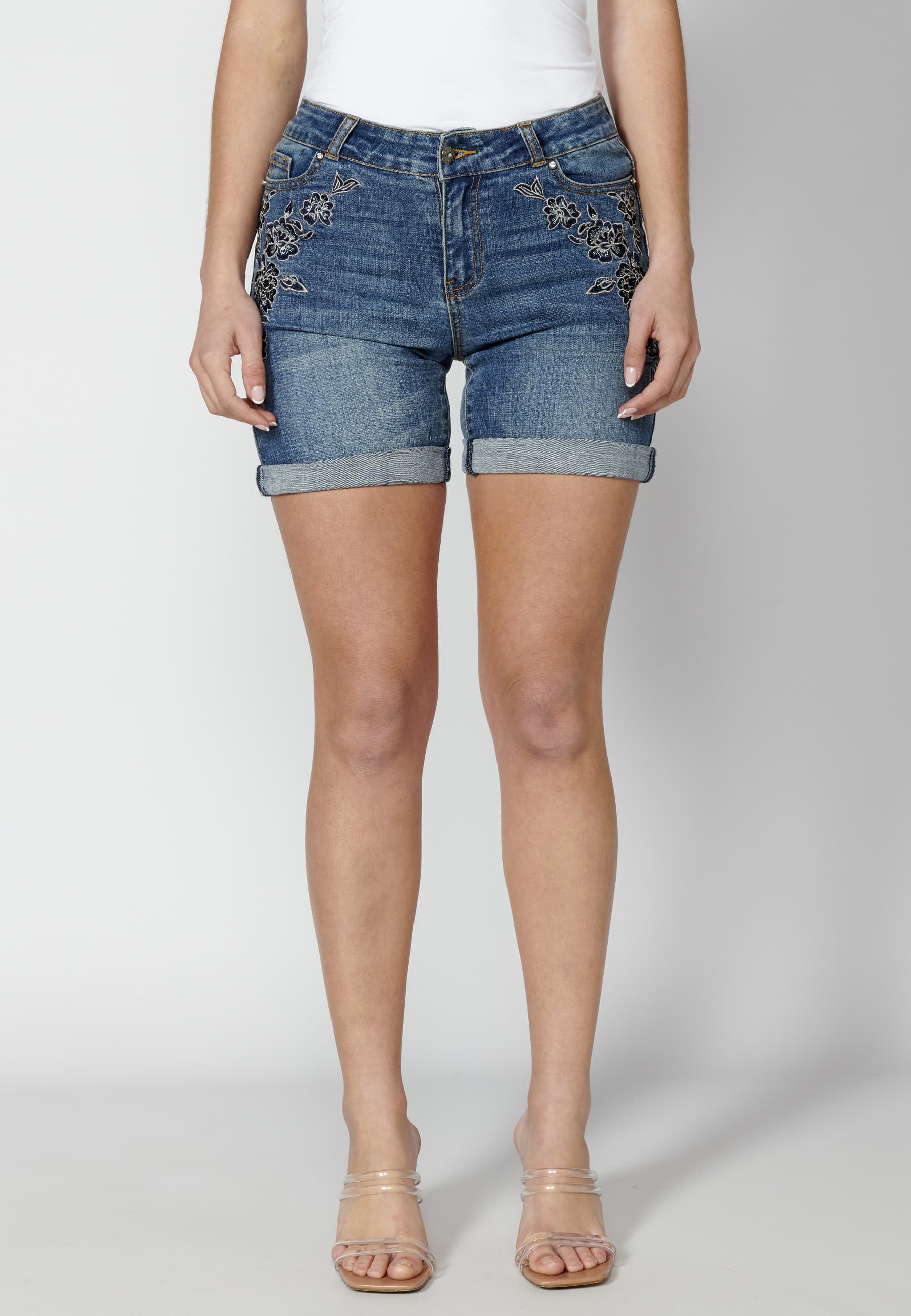 Blue shorts with turn-up finish and floral details for Woman