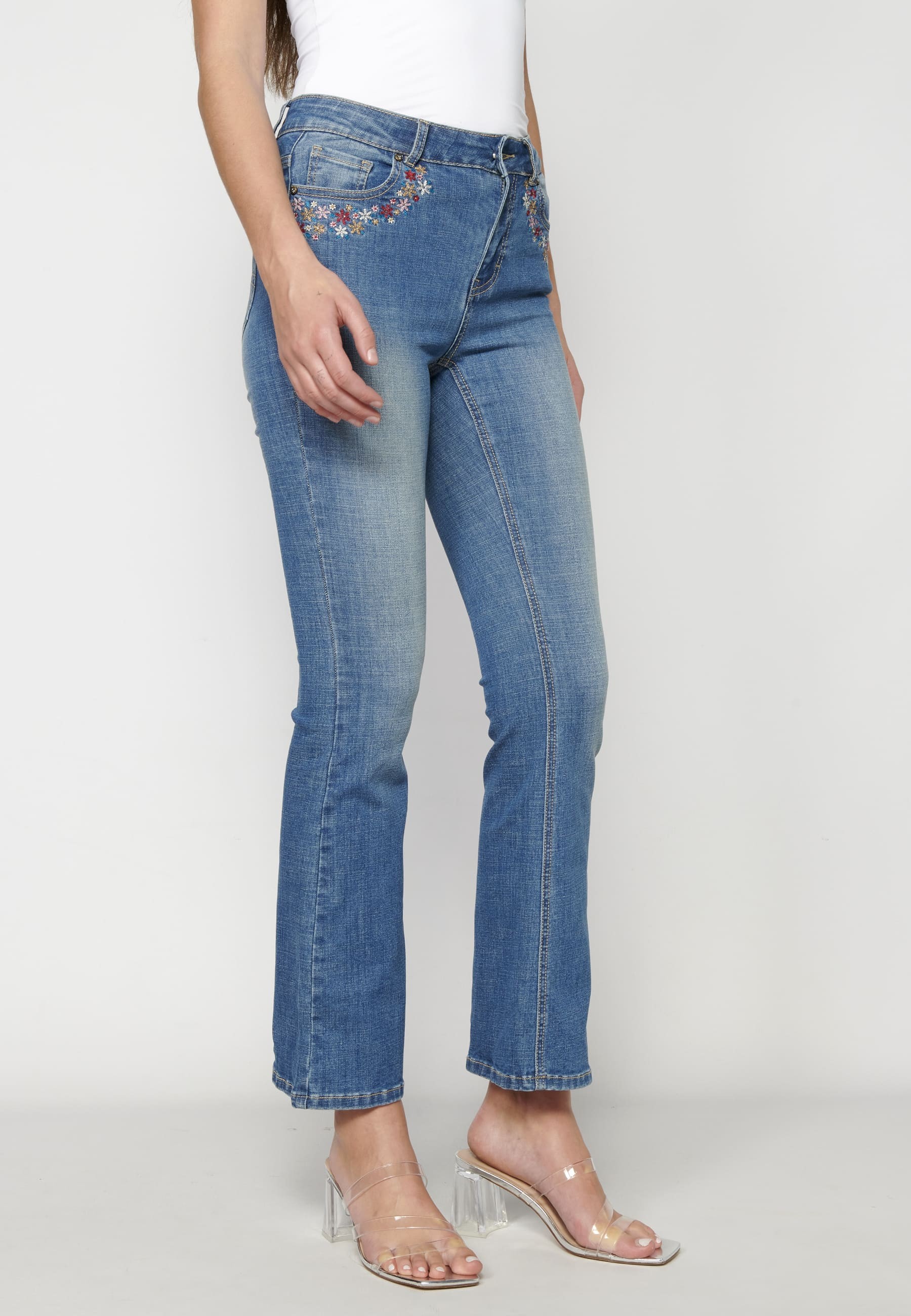 Flared jeans with floral details for Woman