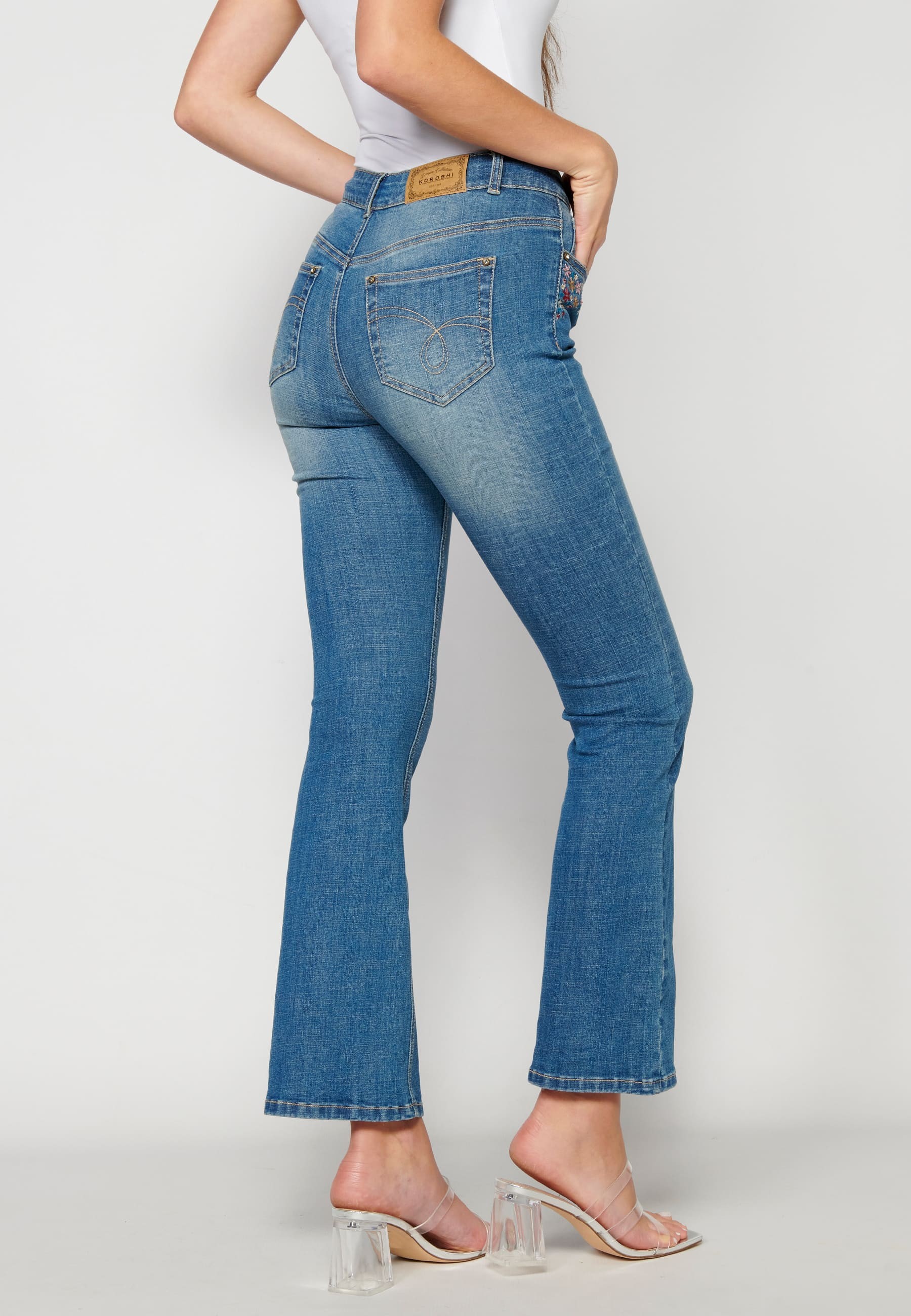 Flared jeans with floral details for Woman