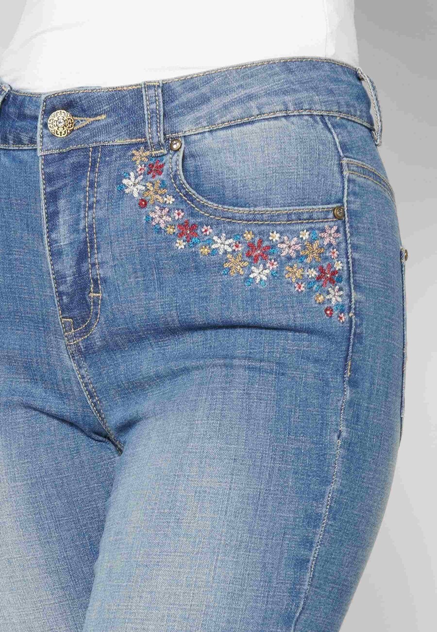 Flared jeans with floral details for Woman 7