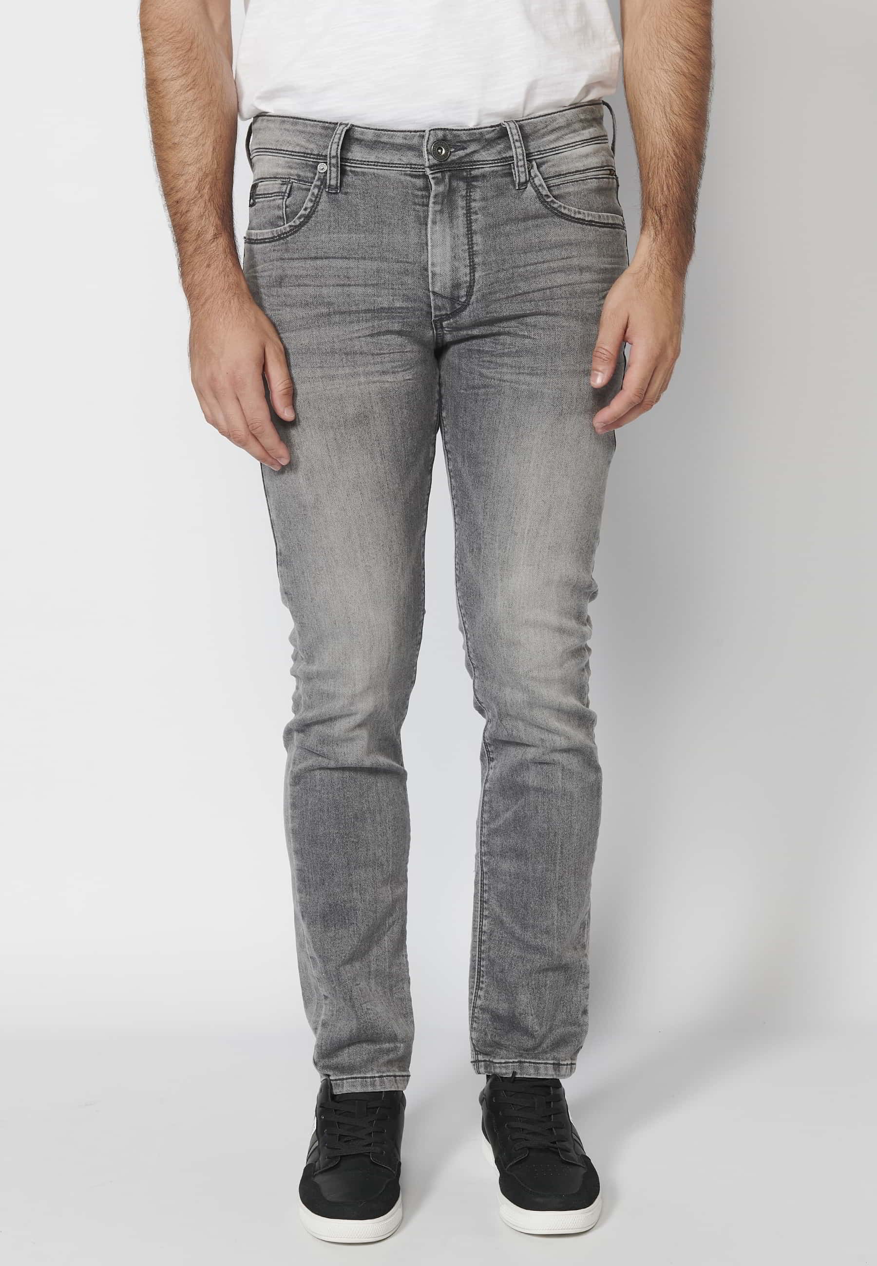 Pantalon en jean coupe slim gris avec fermeture éclair et bouton et cinq poches couleur denim pour Homme