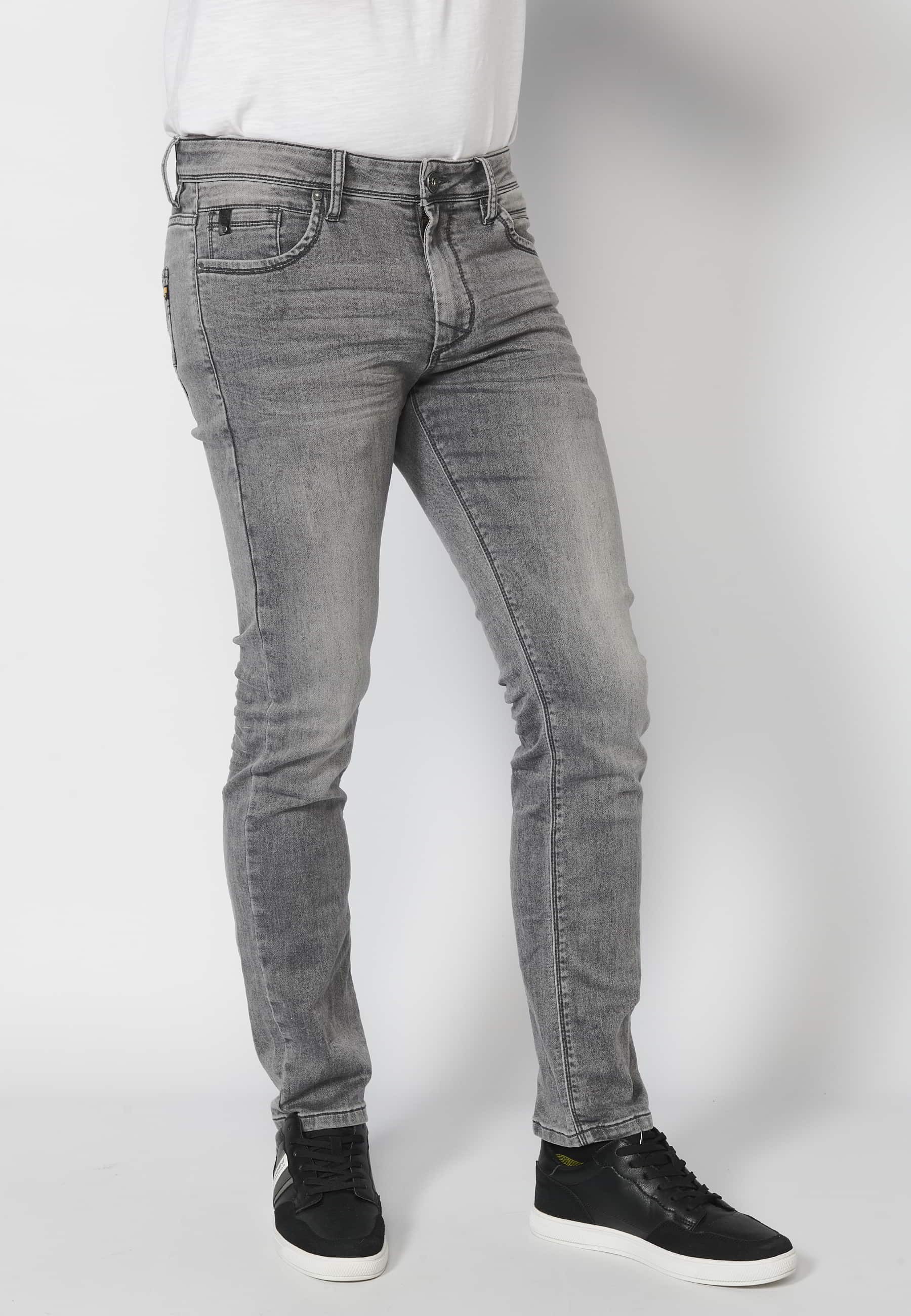 Pantalon en jean coupe slim gris avec fermeture éclair et bouton et cinq poches couleur denim pour Homme