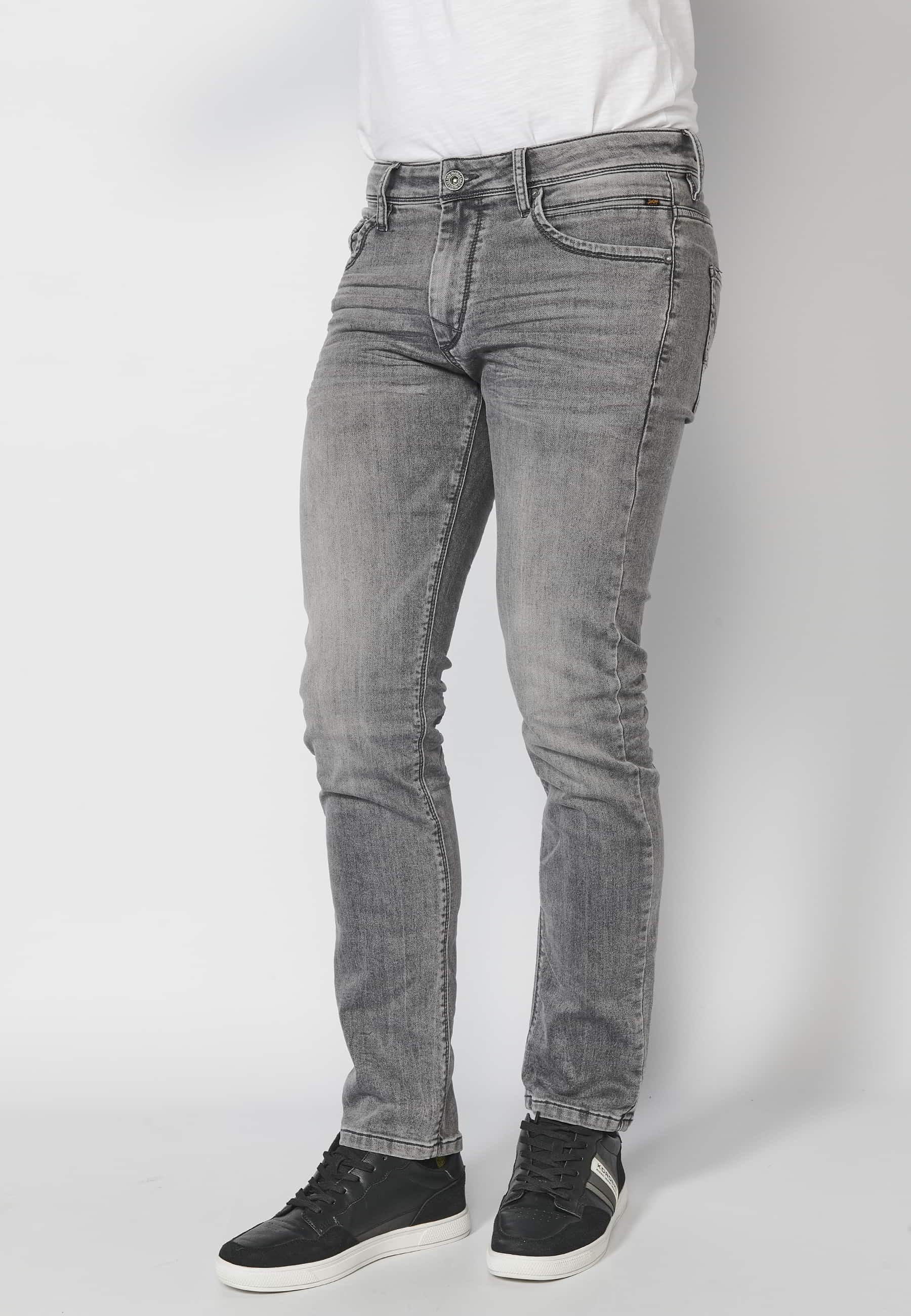 Gray slim fit jean trousers with zipper and button and five pockets in denim color for Men