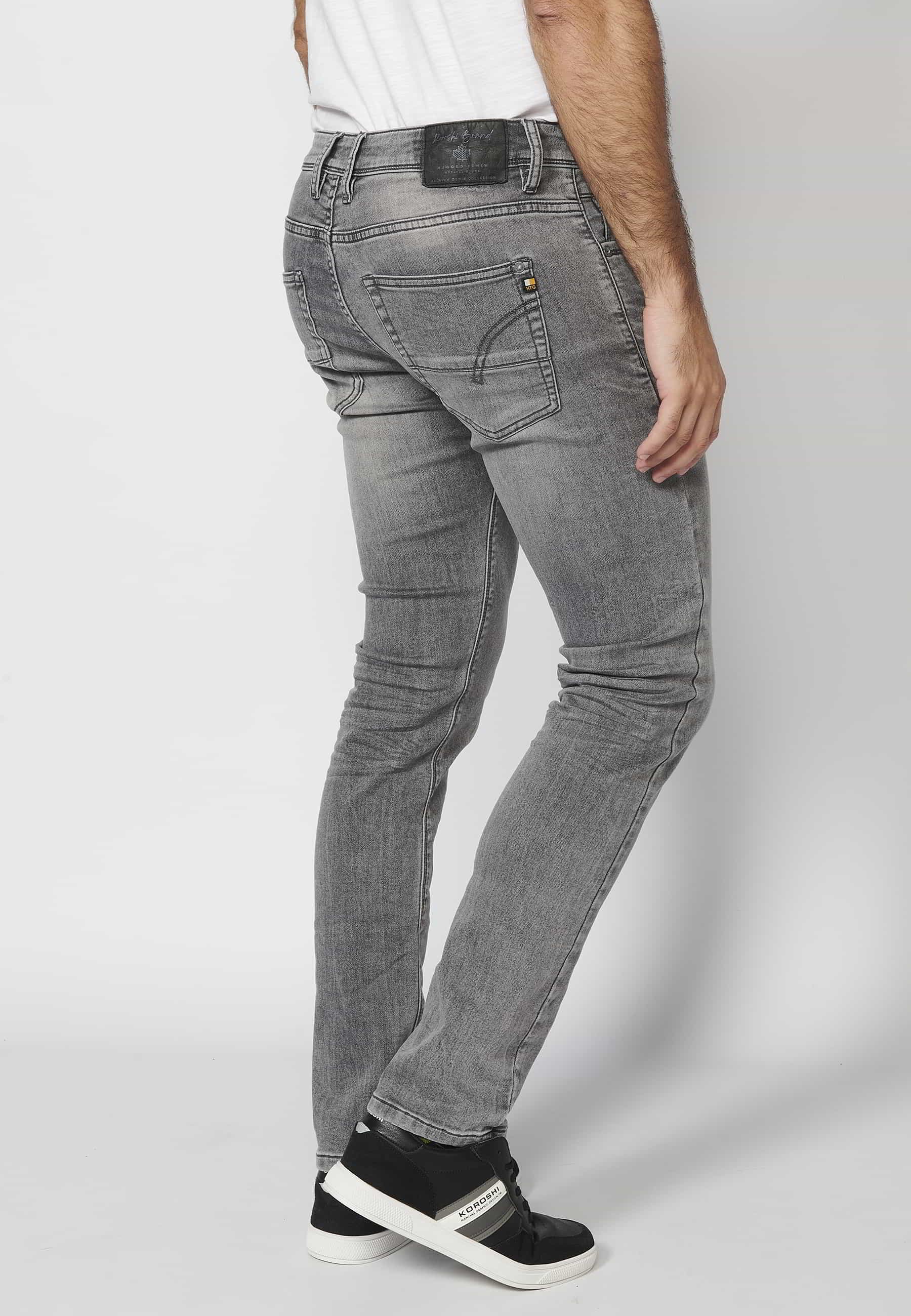 Gray slim fit jean trousers with zipper and button and five pockets in denim color for Men