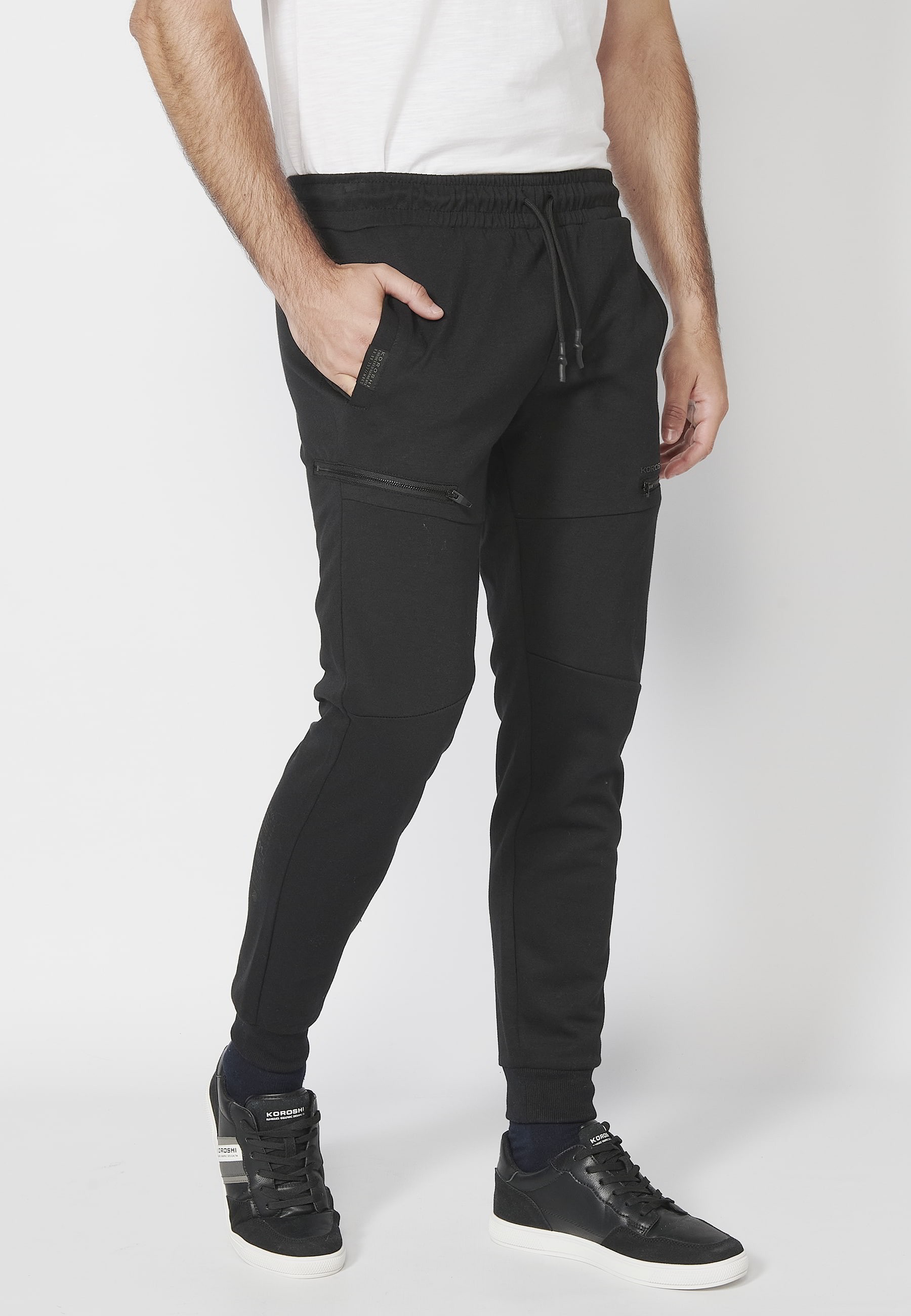 Pantalon de jogging long avec ceinture élastiquée et cordon de serrage avec découpes aux genoux de couleur Noir pour Homme