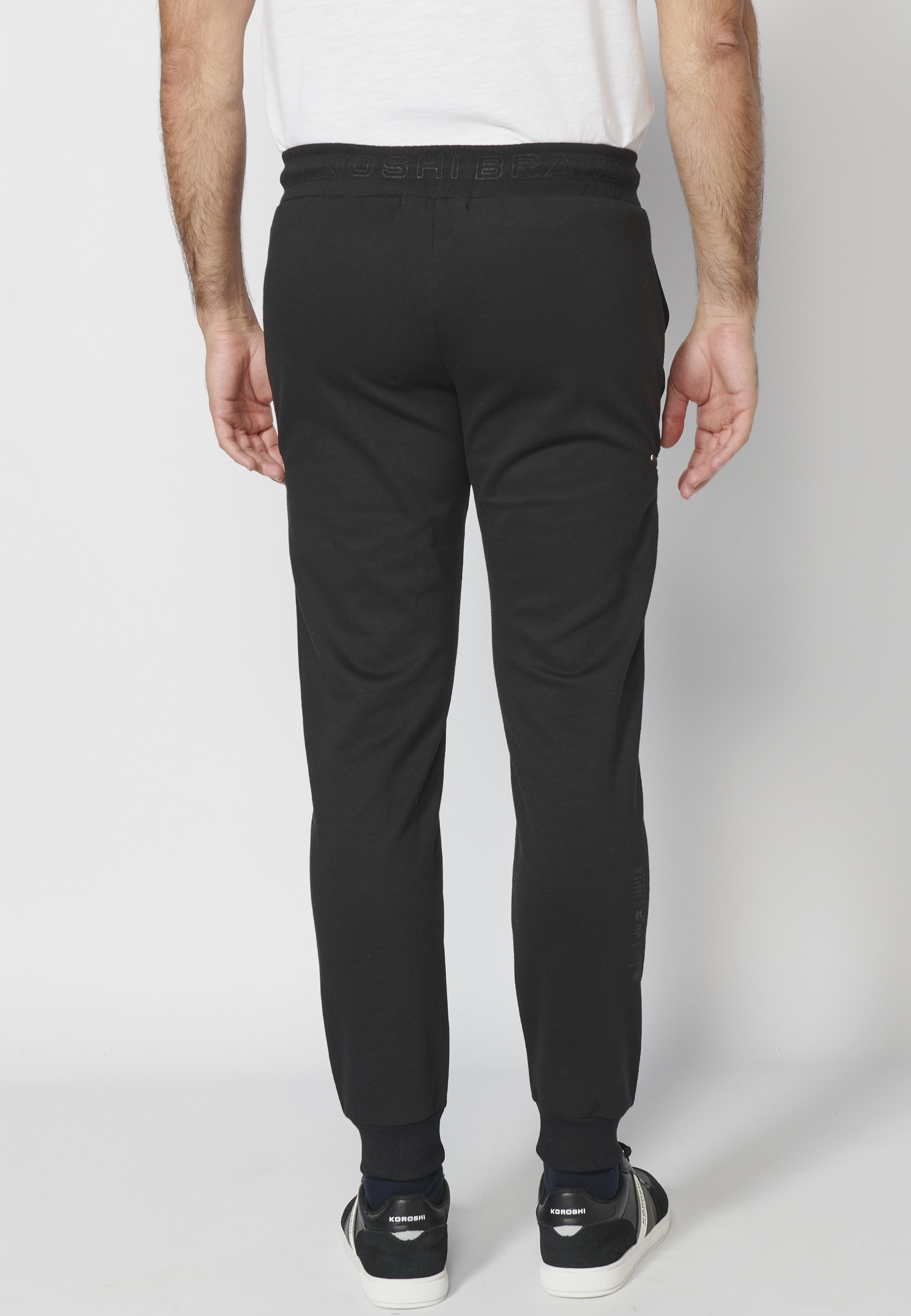 Pantalon de jogging long avec ceinture élastiquée et cordon de serrage avec découpes aux genoux de couleur Noir pour Homme
