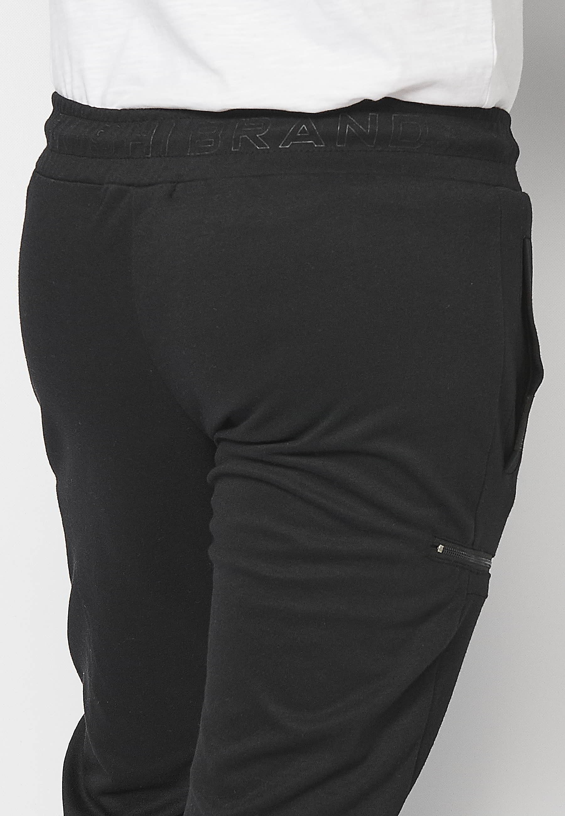 Lange Jogginghose mit elastischem Bund und Kordelzug mit Ausschnitten an den Knien in der Farbe Schwarz für Herren