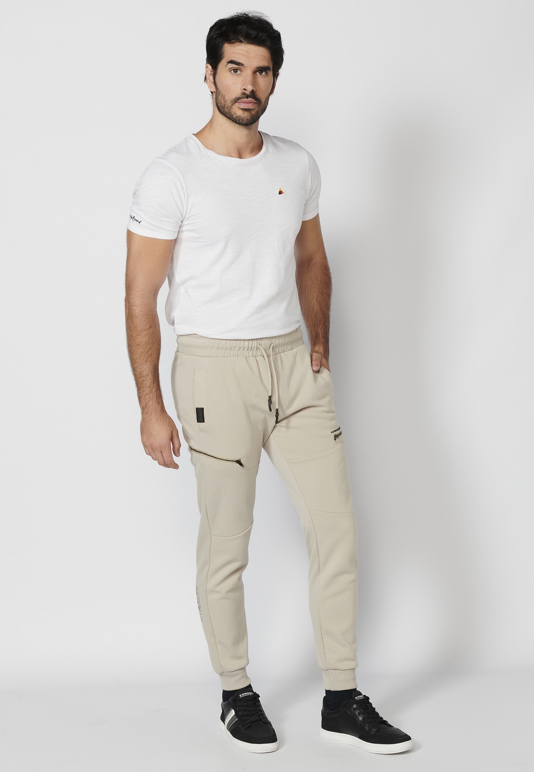 Long jogger pants with a rubberized waist and drawstring with cut-outs in the knees, Stone color, for Men