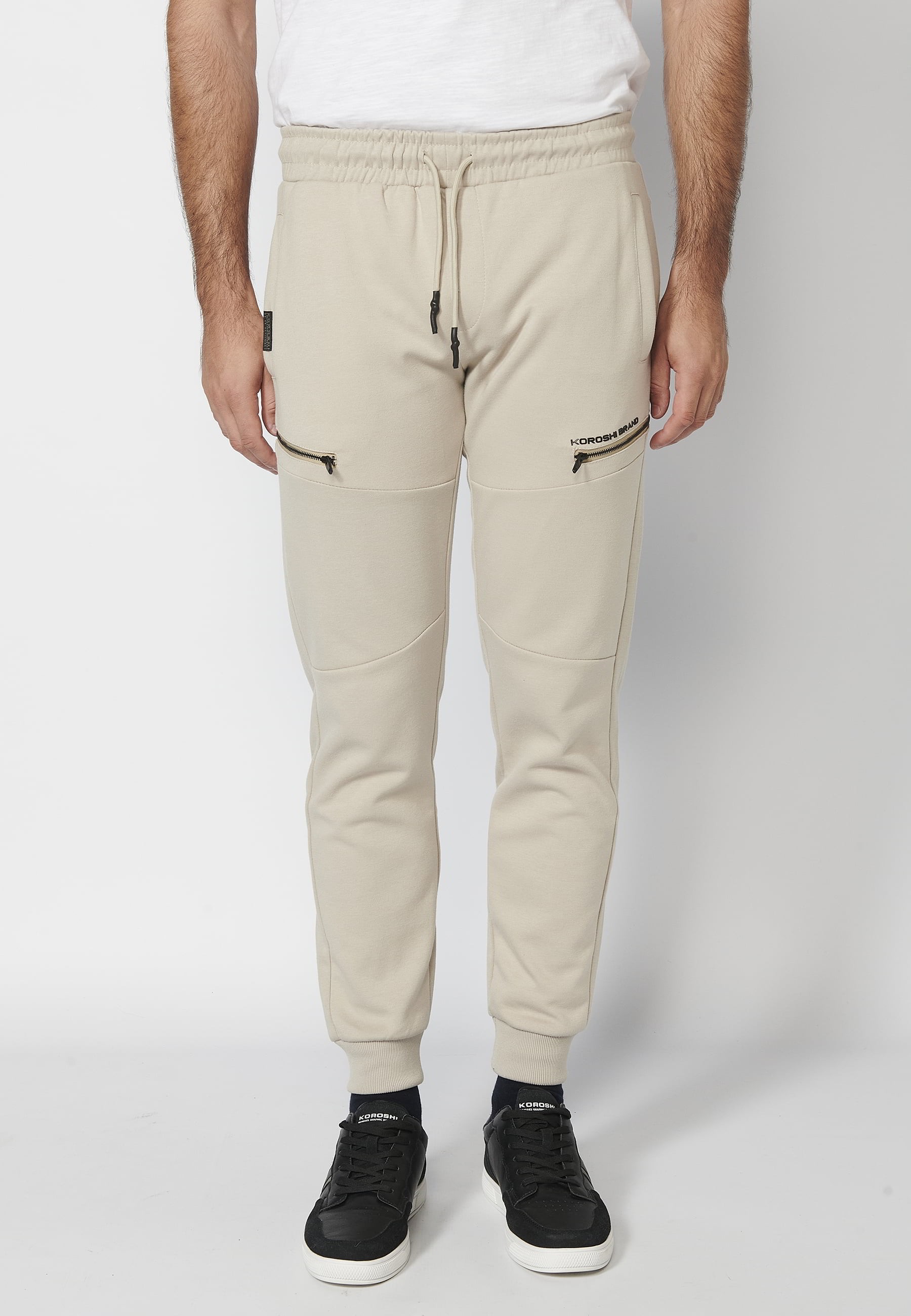 Long jogger pants with a rubberized waist and drawstring with cut-outs in the knees, Stone color, for Men 2