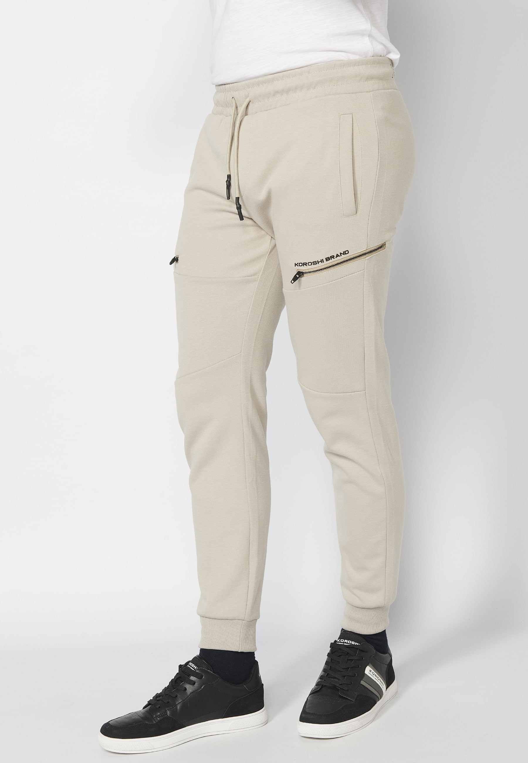 Long jogger pants with a rubberized waist and drawstring with cut-outs in the knees, Stone color, for Men 4