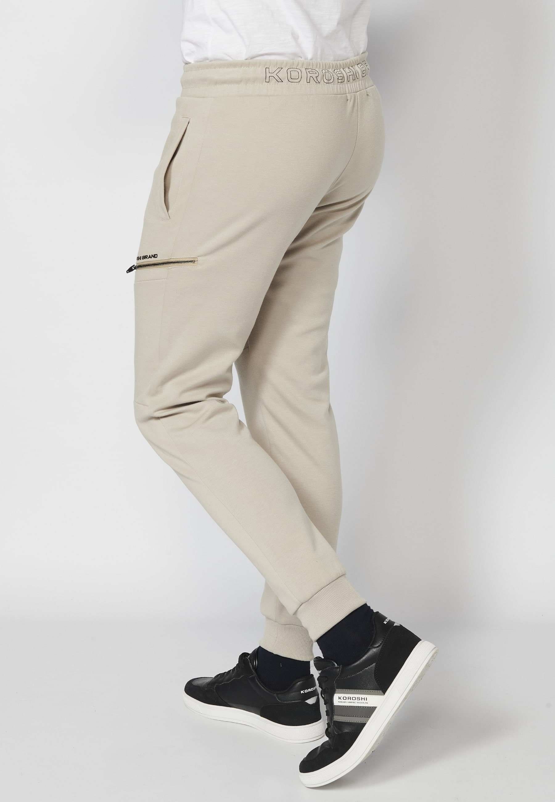 Long jogger pants with a rubberized waist and drawstring with cut-outs in the knees, Stone color, for Men 7