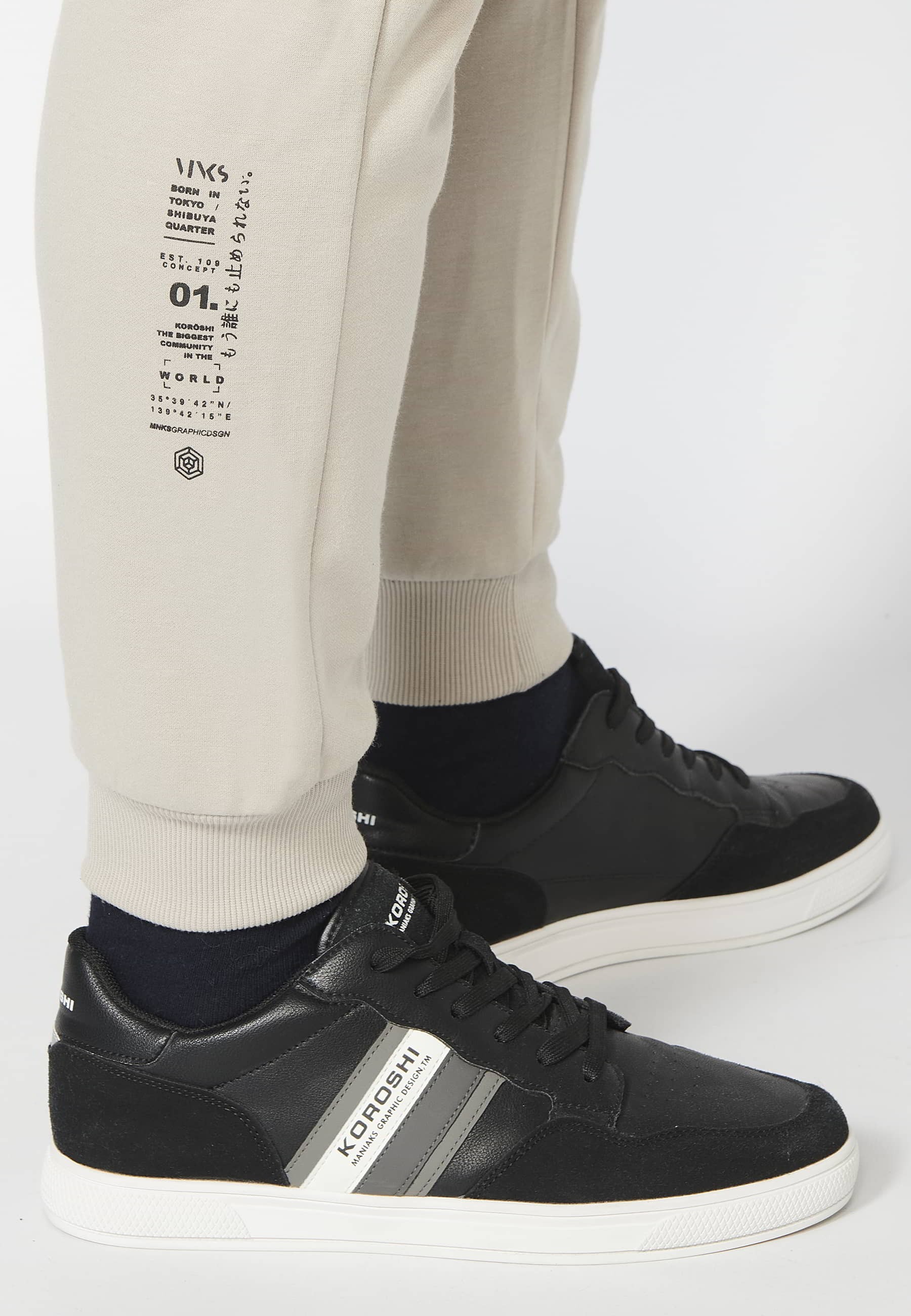 Long jogger pants with a rubberized waist and drawstring with cut-outs in the knees, Stone color, for Men 6