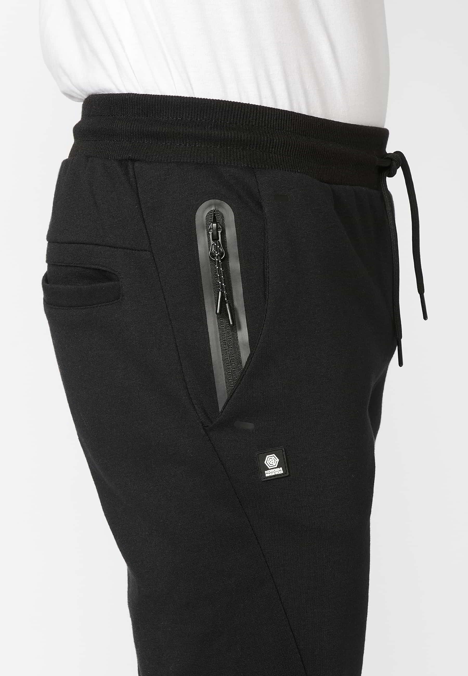 Pantalon de jogging long avec taille élastique réglable, détail de poche, couleur Noir pour Homme