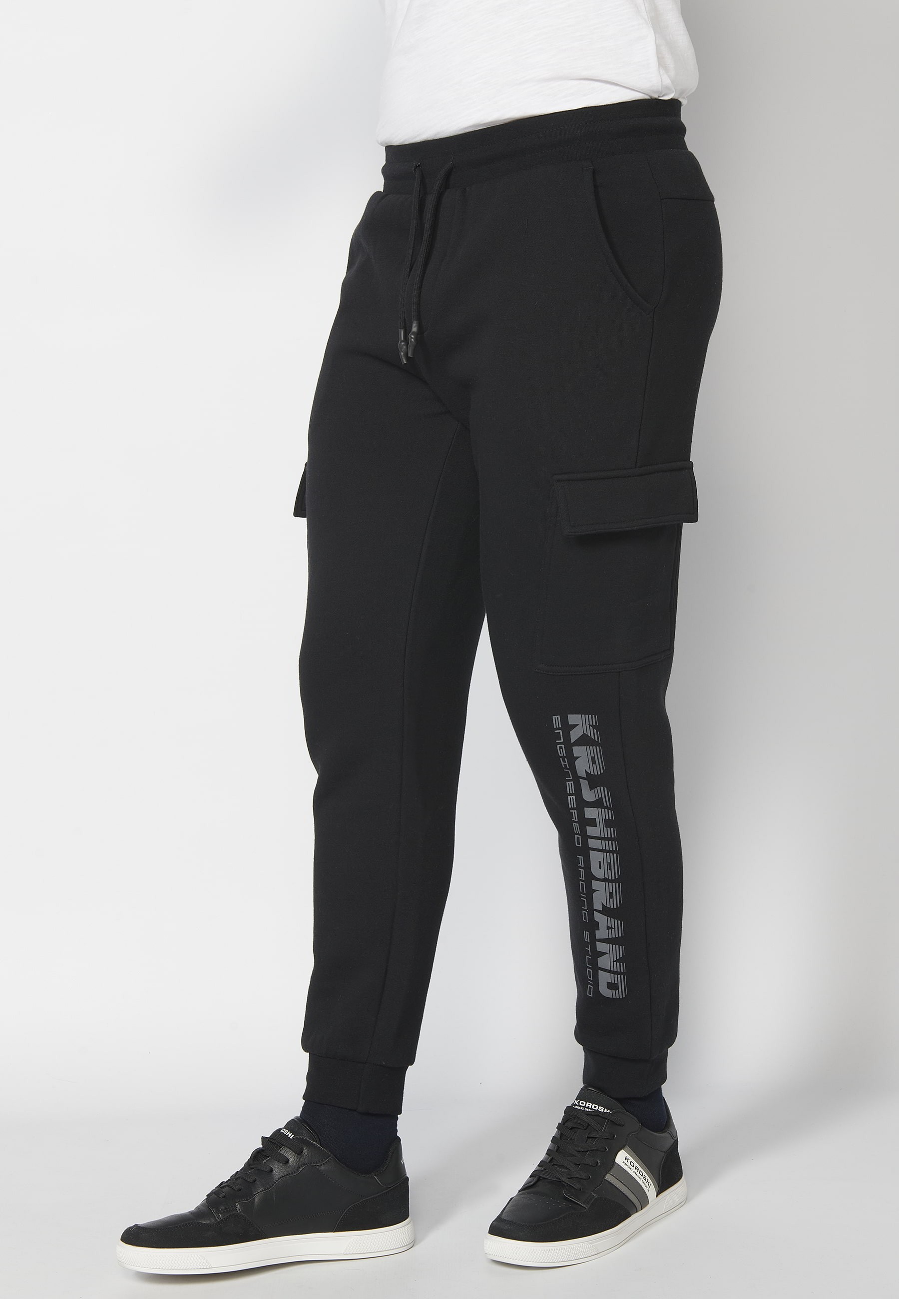 Long jogger pants with adjustable elastic waist and side pockets in Black for Men