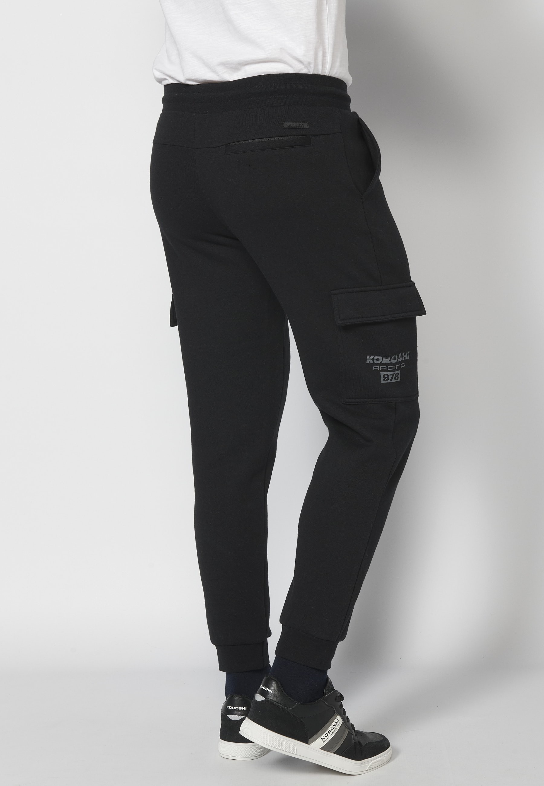 Long jogger pants with adjustable elastic waist and side pockets in Black for Men