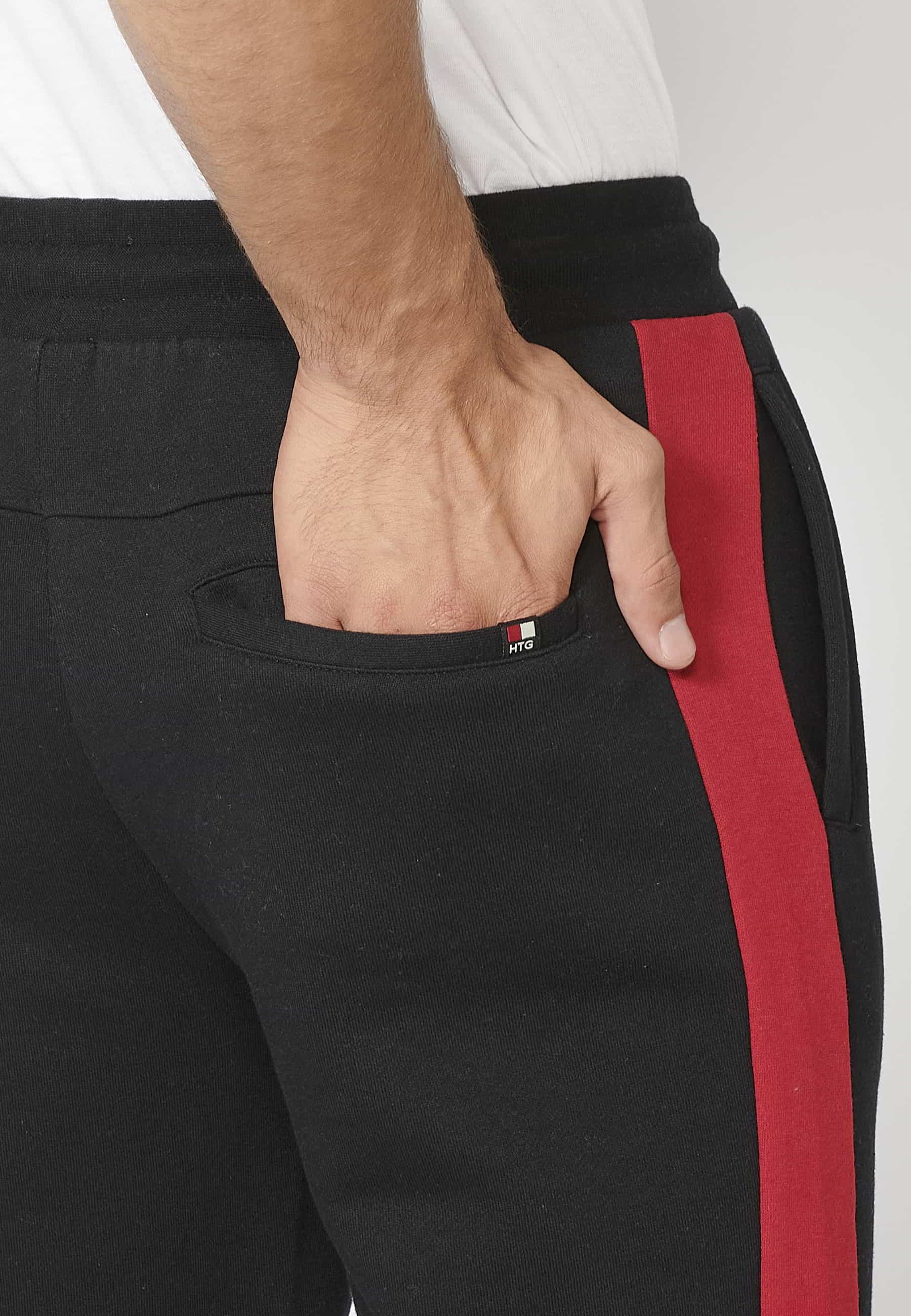 Pantalón Deportivo largo jogger con cintura elástica ajustable, detalle lateral, color negro para Hombre