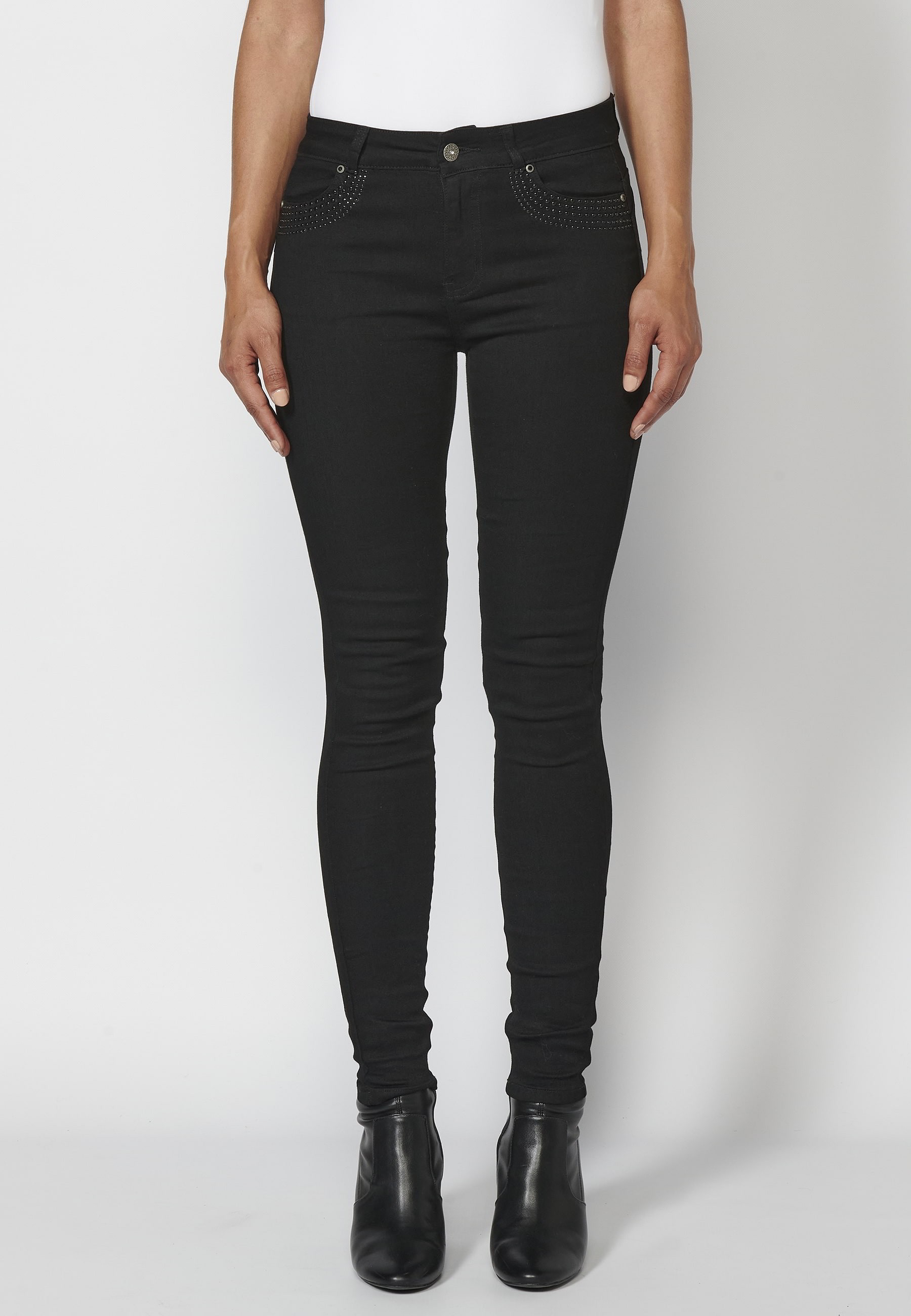 Pantalons llargs jeans slim amb detalls de tatxes en butxaques color Negre per a Dona