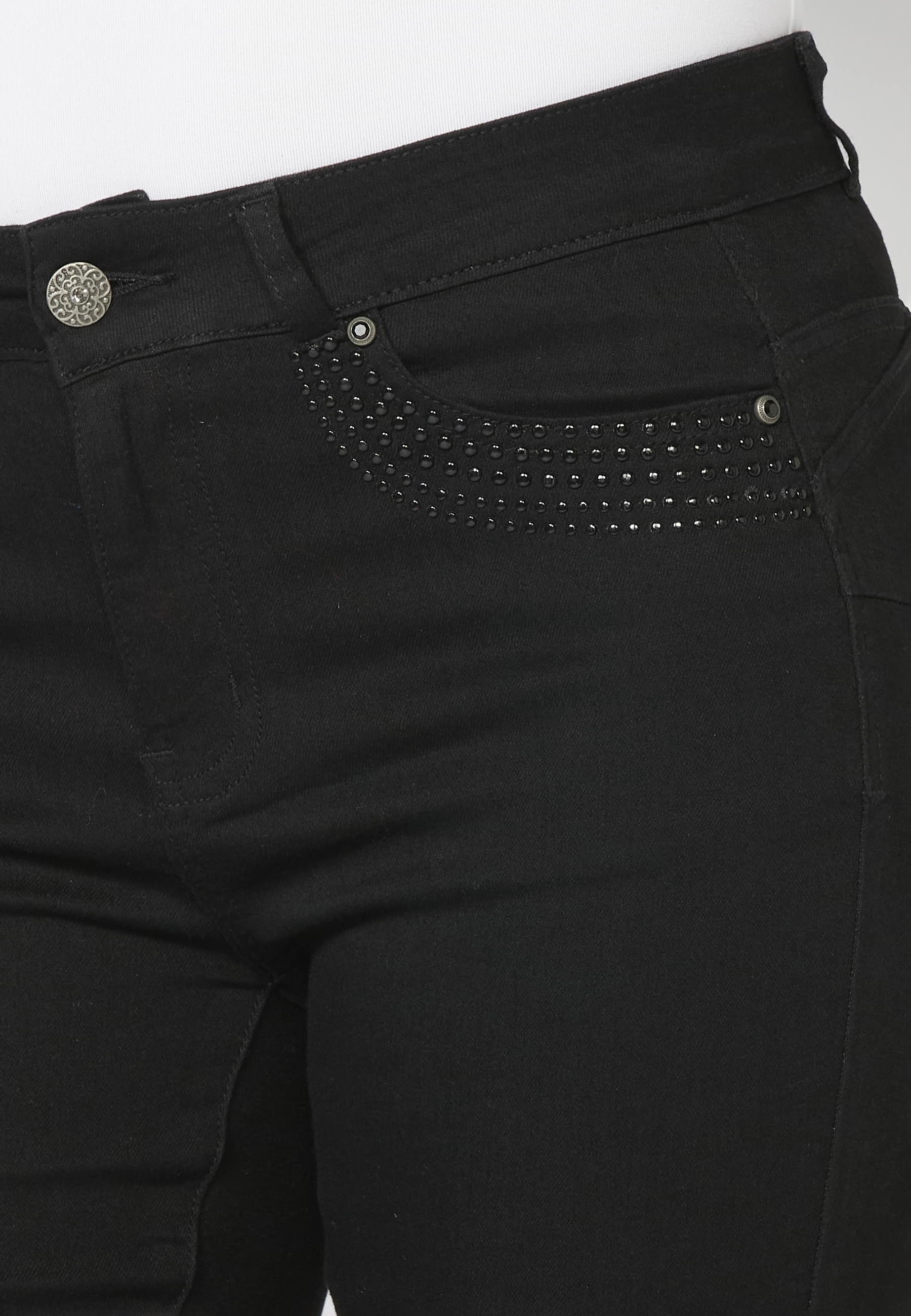 Pantalón largo jeans slim con detalles de tachuelas en bolsillos color Negro para Mujer