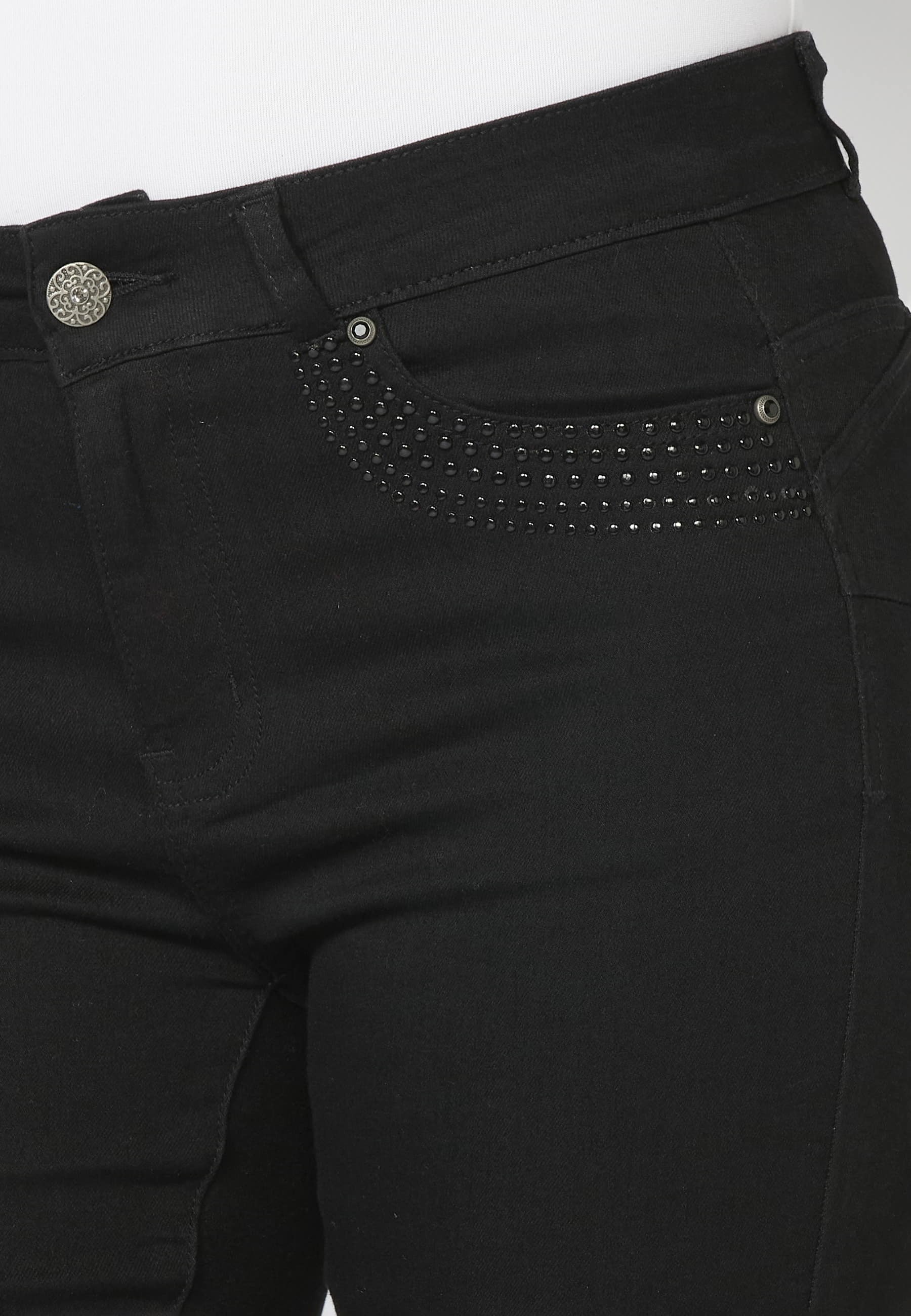 Pantalon long en jean slim avec détails de clous sur les poches de couleur Noir pour Femme