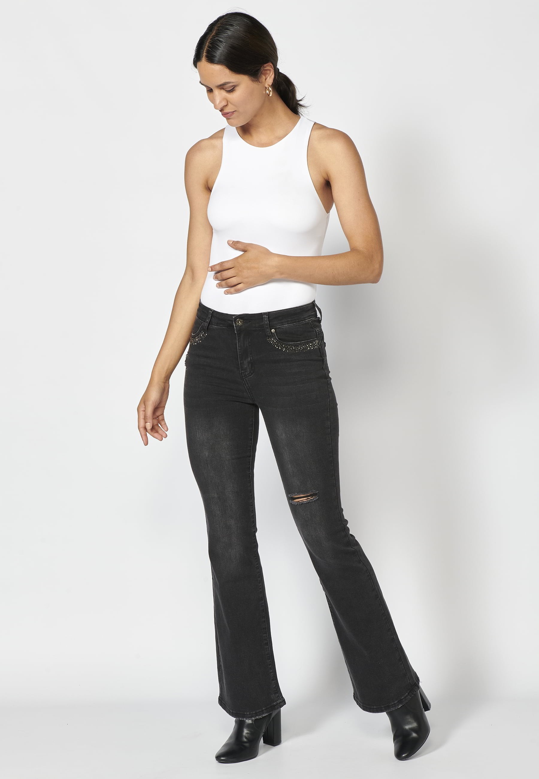 Long denim pants with details in the pockets in Black color for Woman