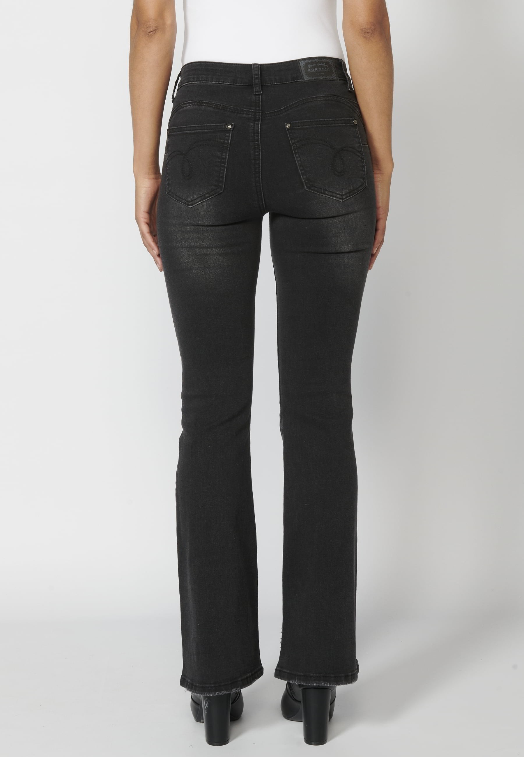 Long denim pants with details in the pockets in Black color for Woman