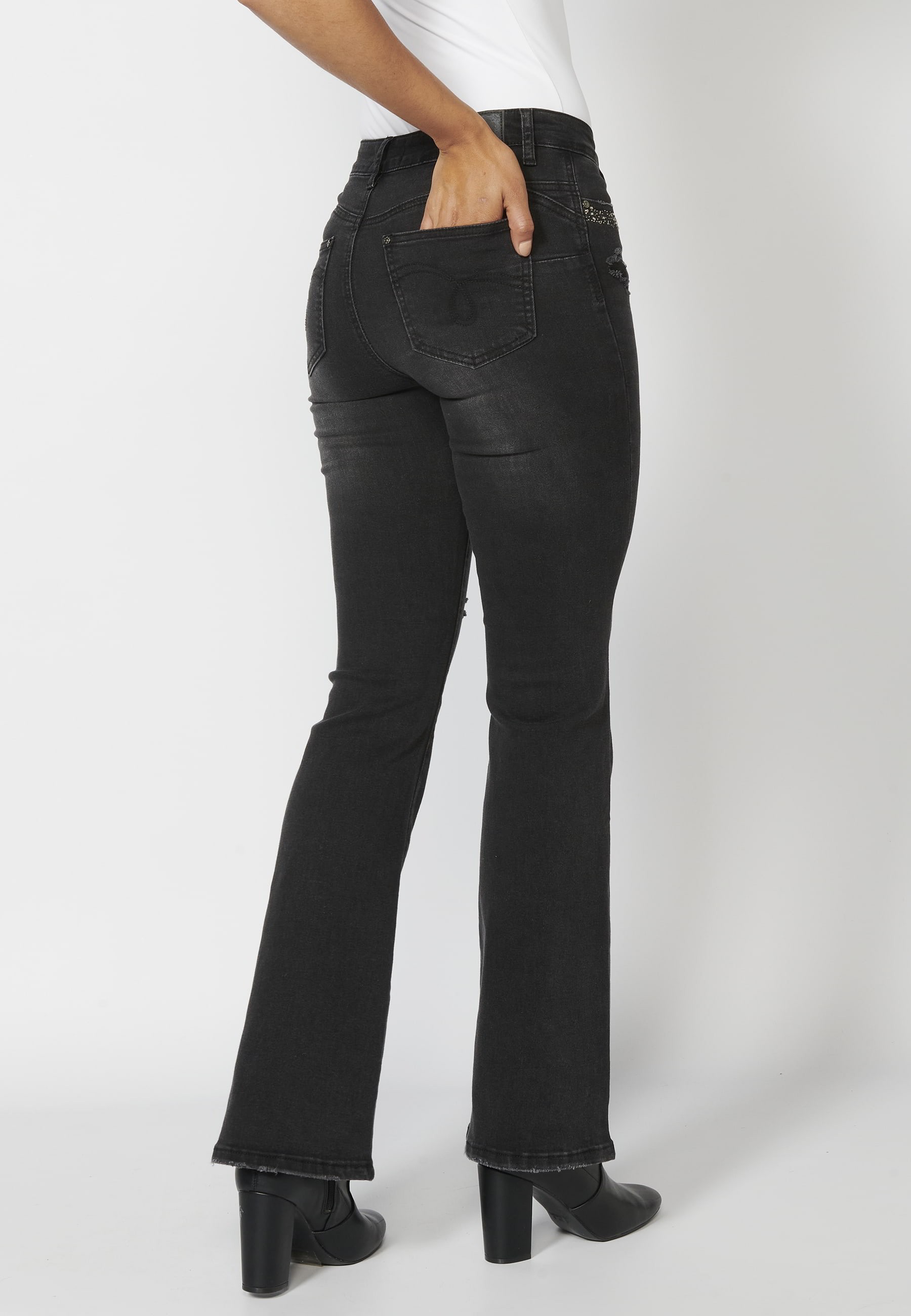 Long denim pants with details in the pockets in Black color for Woman