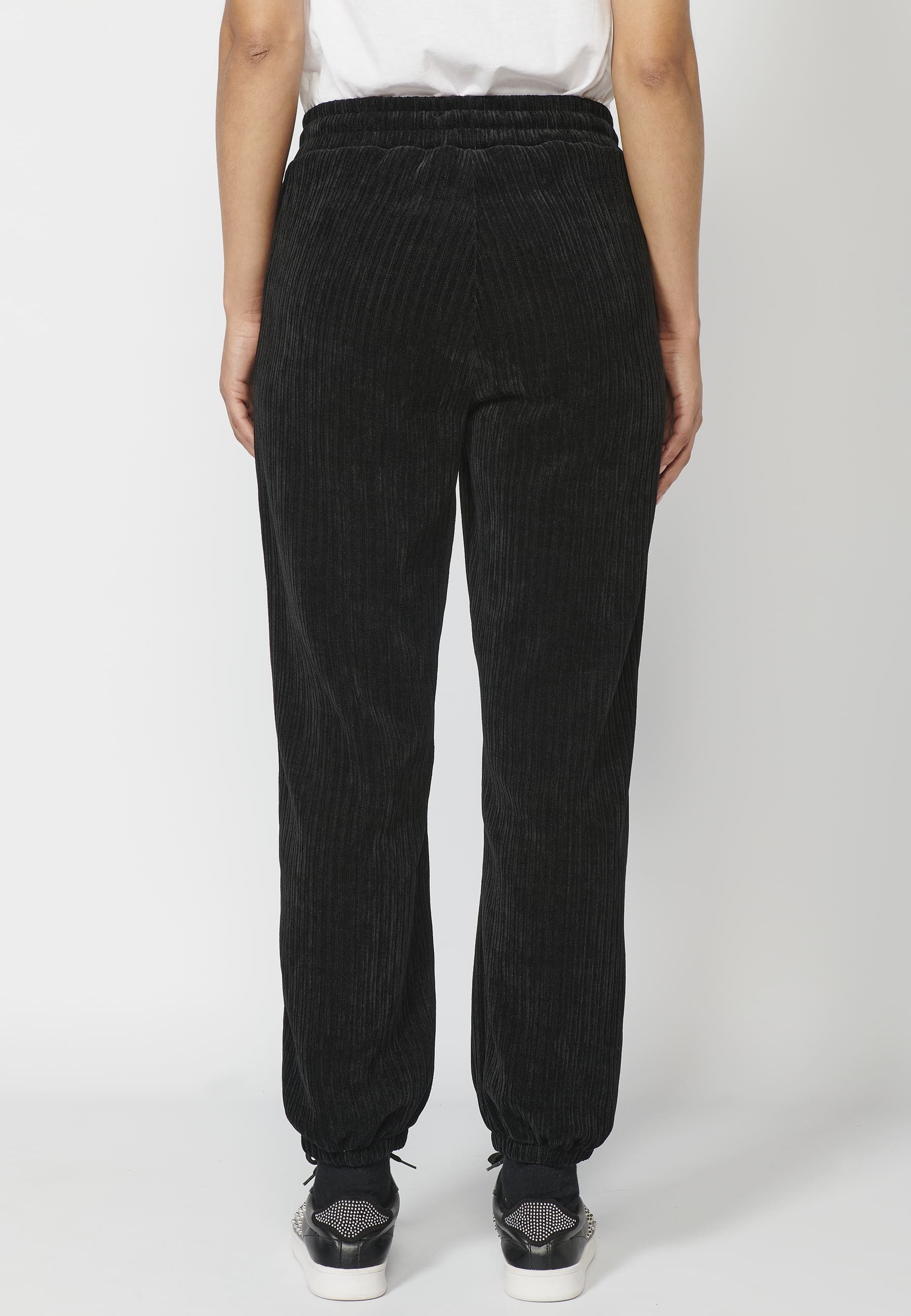 Pantalón largo straigth acabado en goma y ajustable en cintura con cordón color negro para mujer | Moda Actual