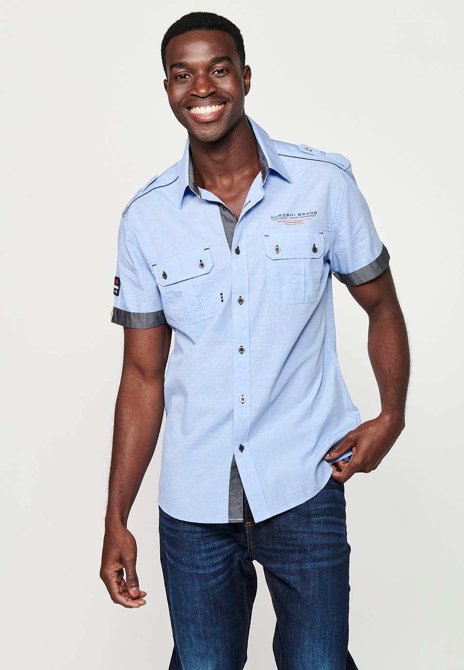 Camisa de cotó, màniga curta, detalls espatlla, color blau per a home