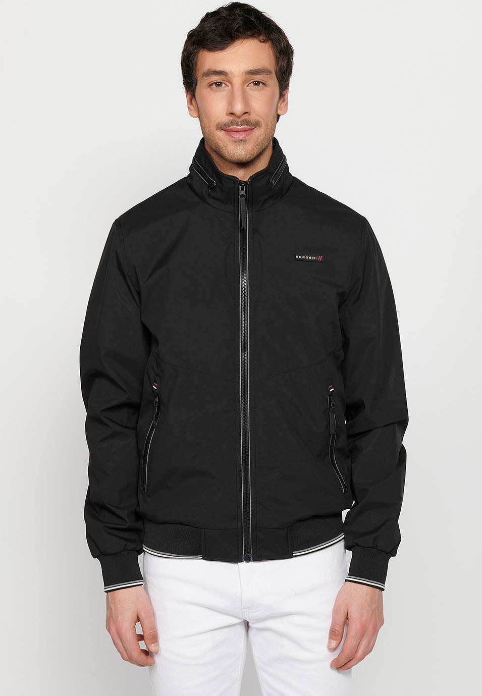 Long-sleeved high-neck windbreaker jacket with front zipper closure and ribbed finishes with pockets, one inside in Black for Men 1