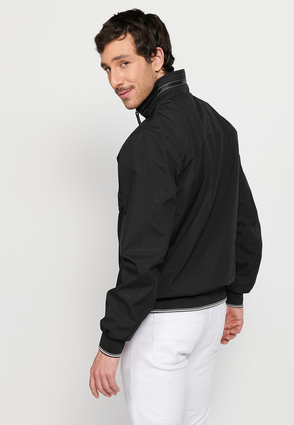 Long-sleeved high-neck windbreaker jacket with front zipper closure and ribbed finishes with pockets, one inside in Black for Men 6