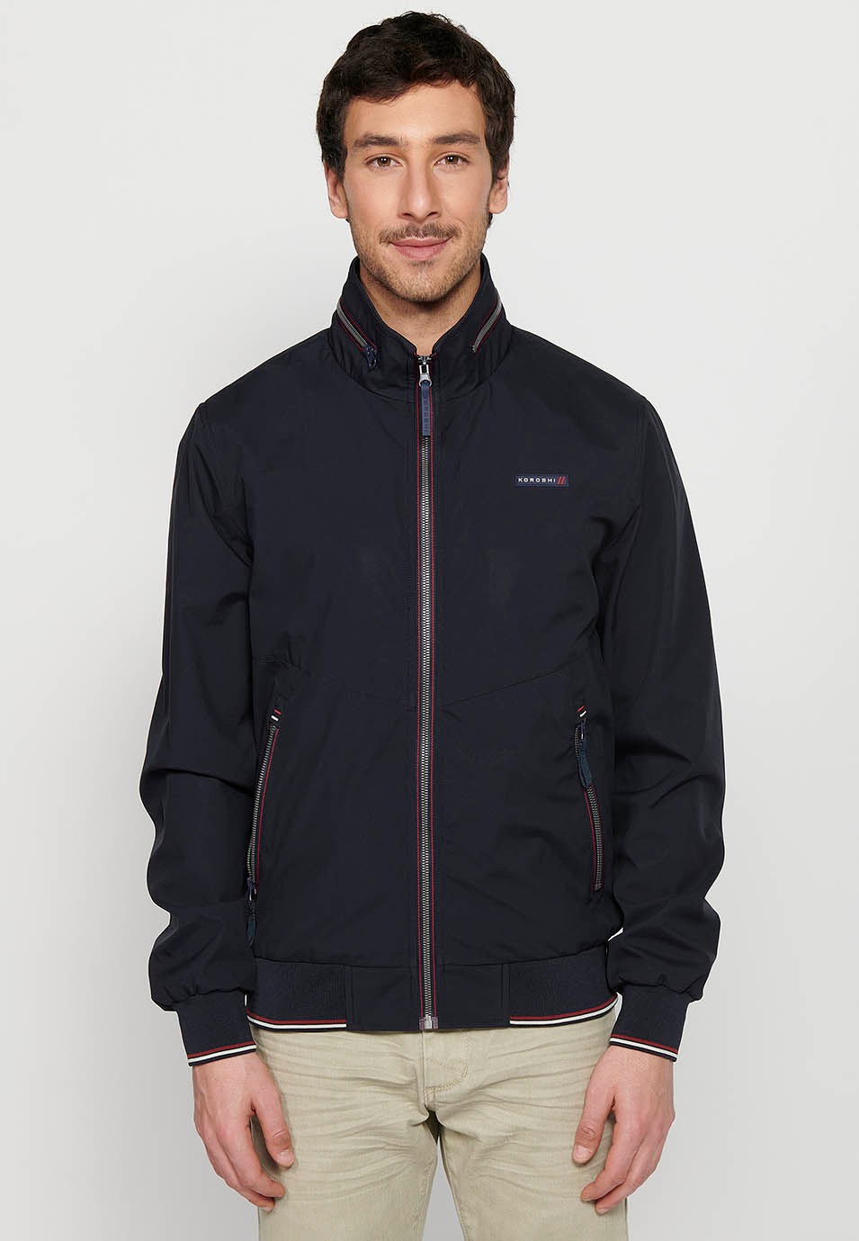 Long-sleeved high-neck jacket with front zipper closure and ribbed finishes with pockets, one inside in Navy for Men 1