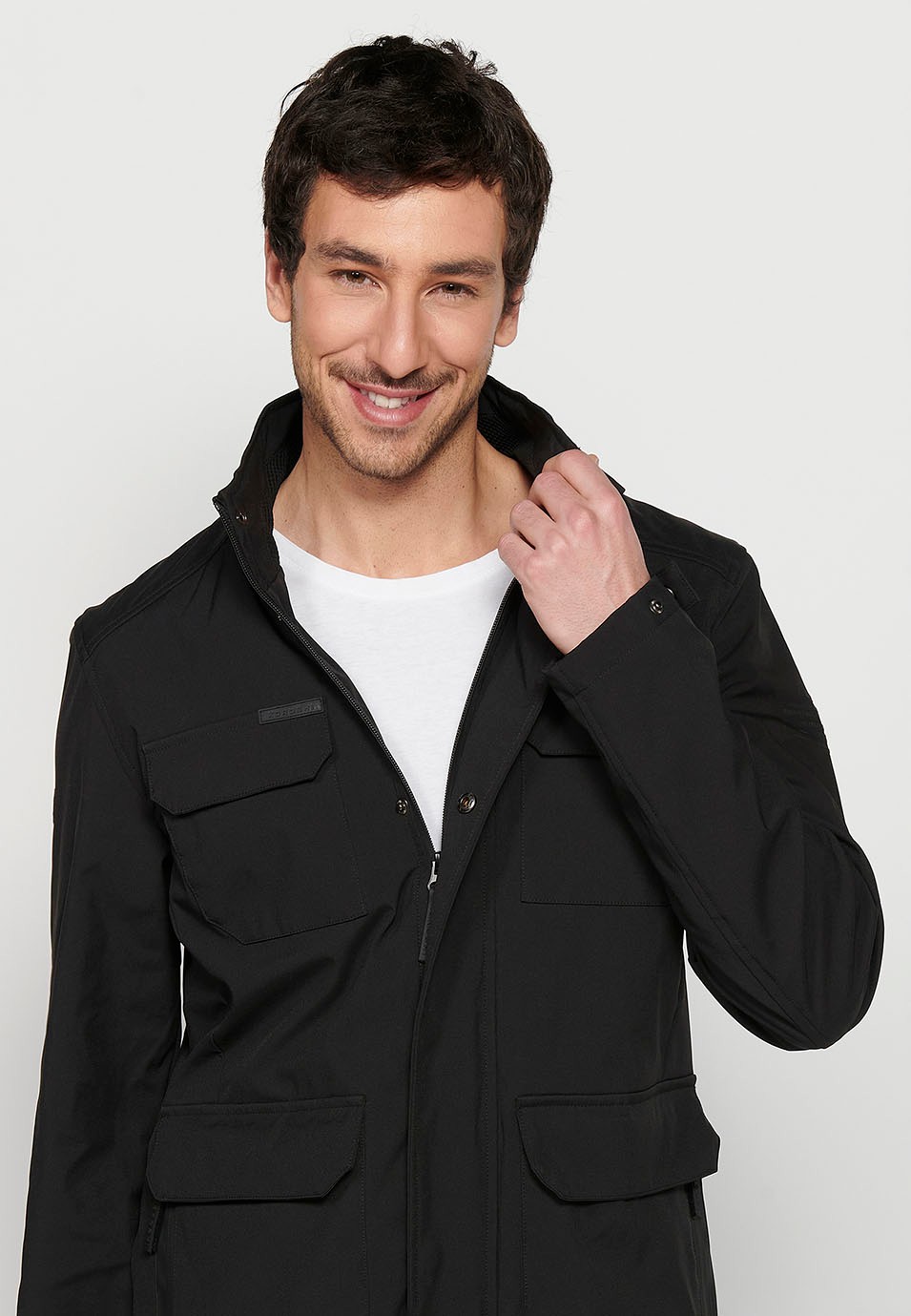 Long Black High Neck Windbreaker Jacket with Front Zipper Closure and Four Flap Pockets for Men 1