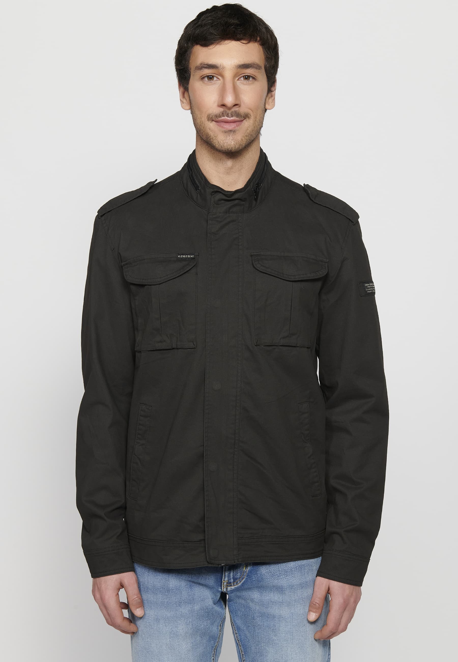 Long-sleeved jacket with high collar and front zipper closure with pockets in black for men.