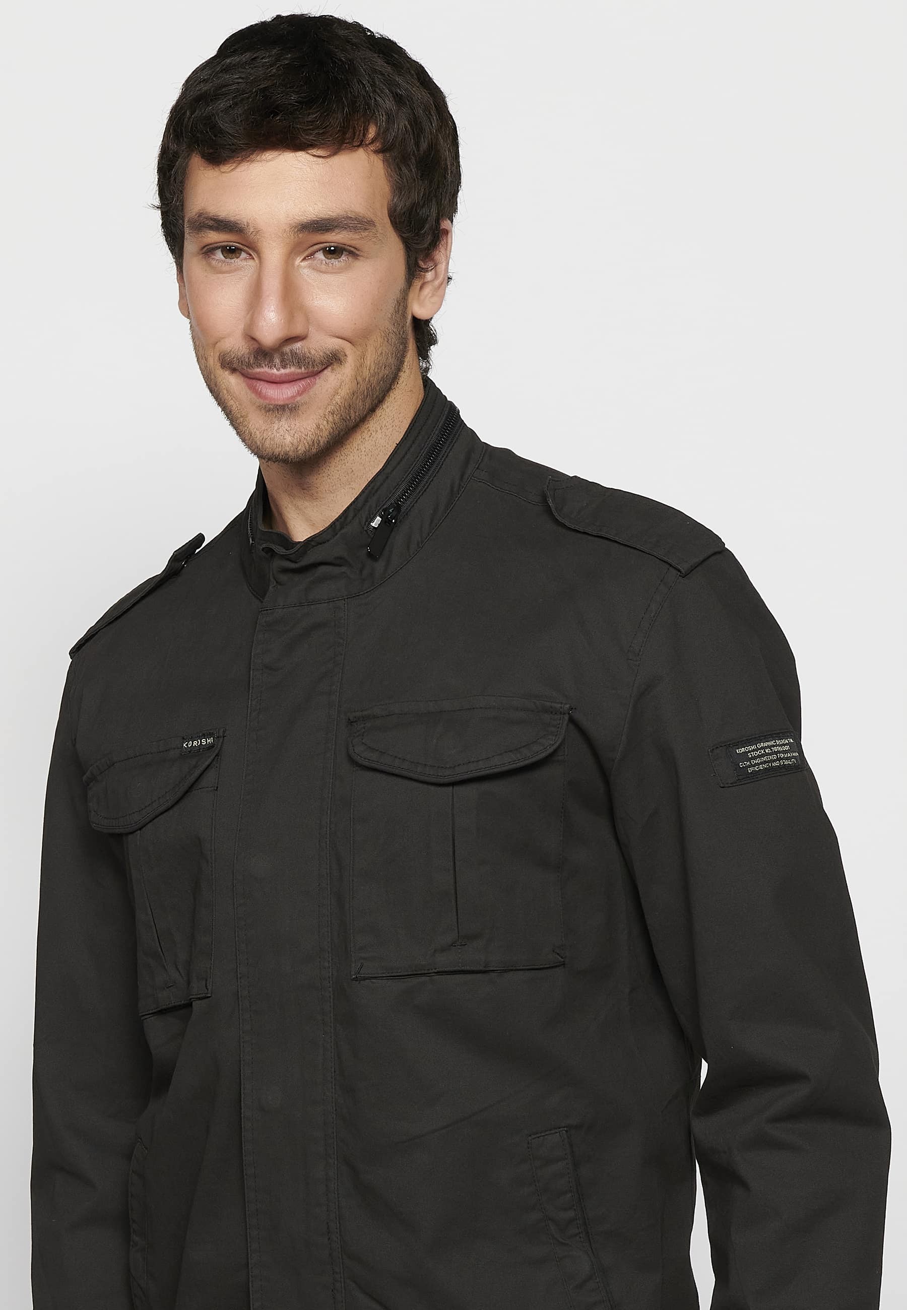 Long-sleeved jacket with high collar and front zipper closure with pockets in black for men. 1