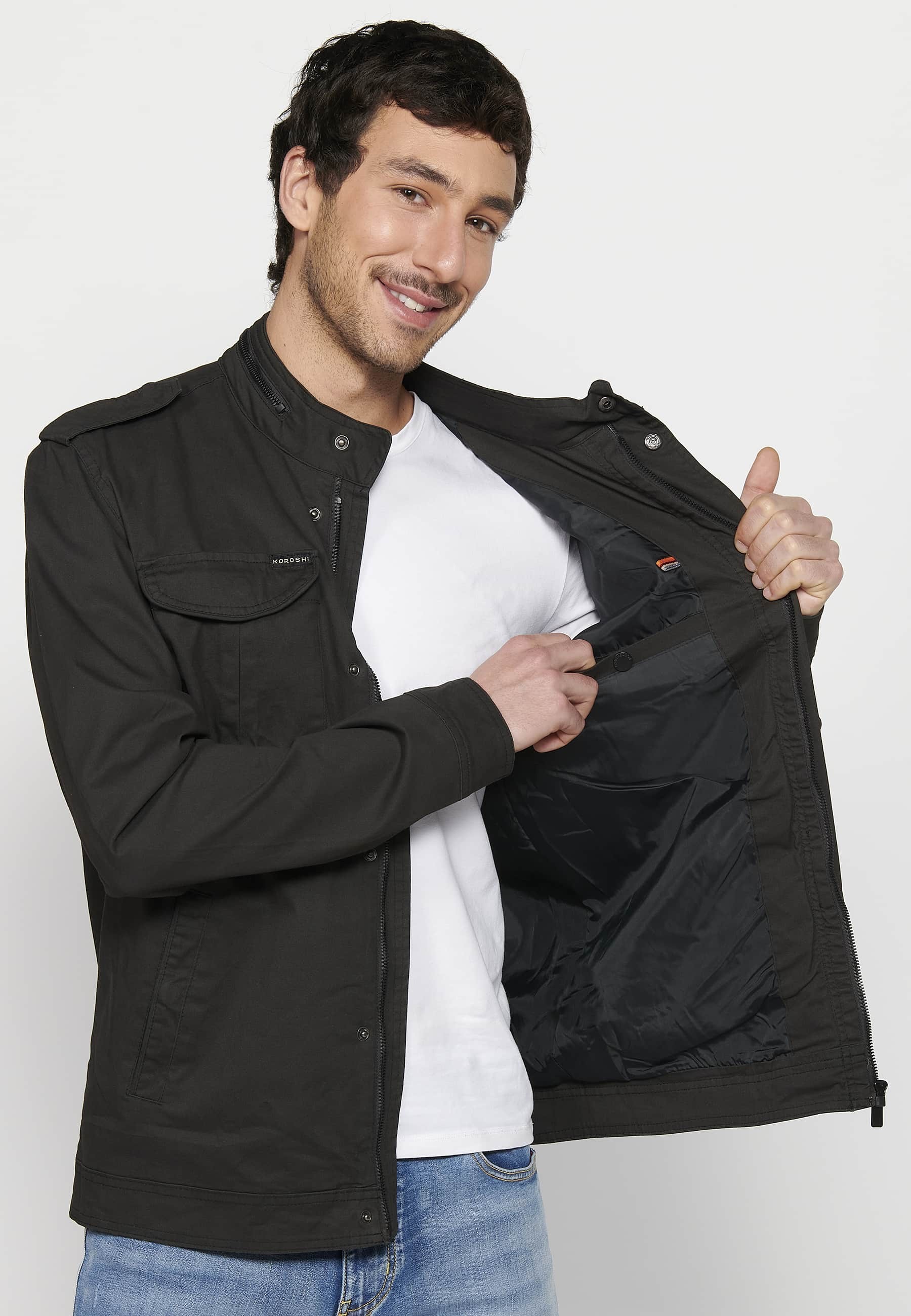 Long-sleeved jacket with high collar and front zipper closure with pockets in black for men. 9
