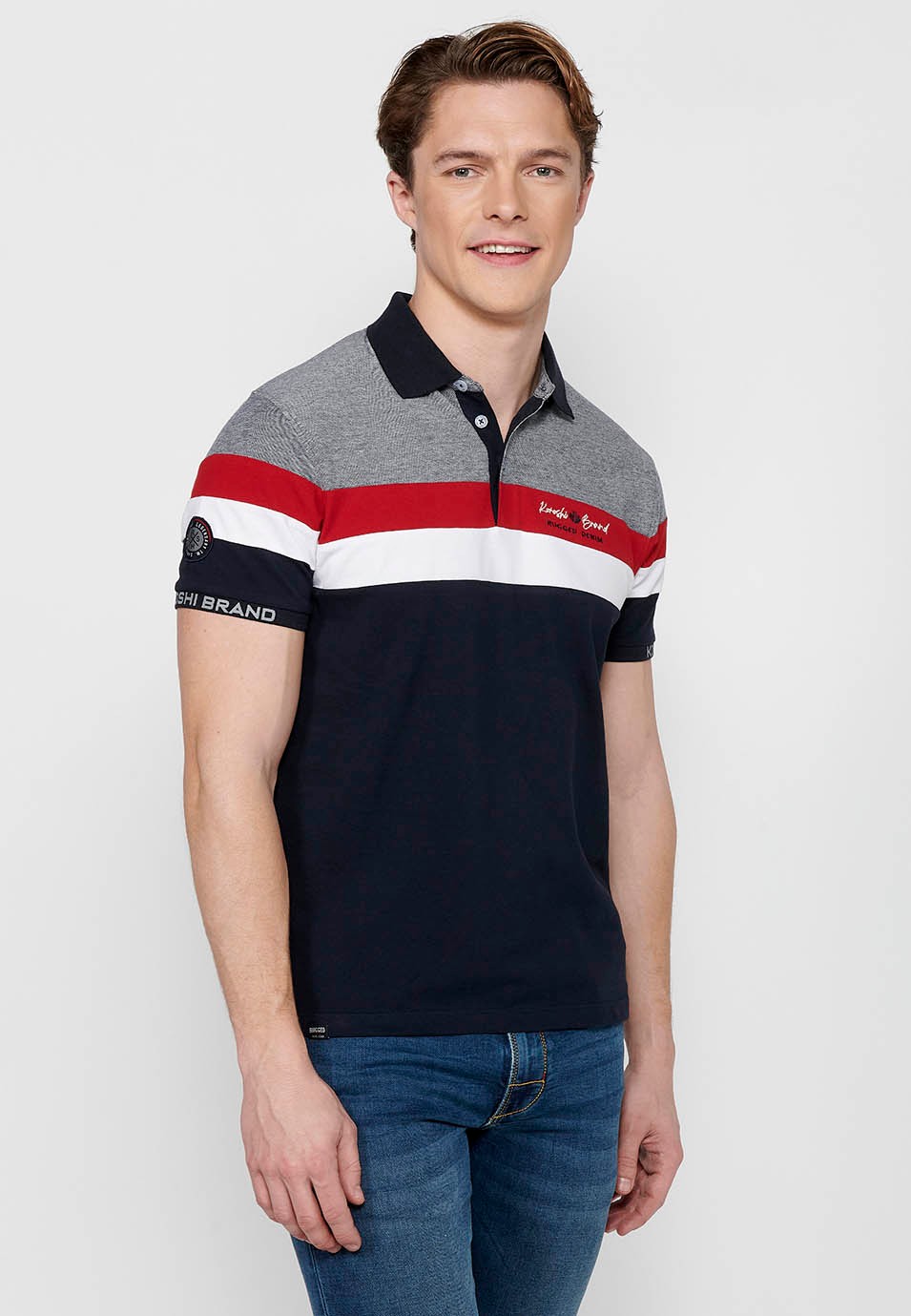 Polo manches courtes 100% coton, détail rayé sur la poitrine, coloris marine pour homme