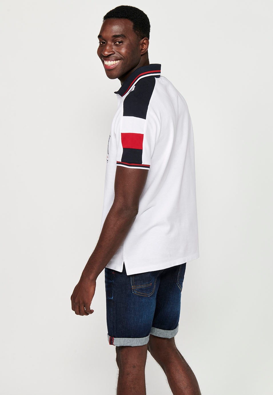 Short-sleeved cotton polo shirt with buttoned shirt collar and front detail with sleeves finished in rib and finished with side slits in White for Men