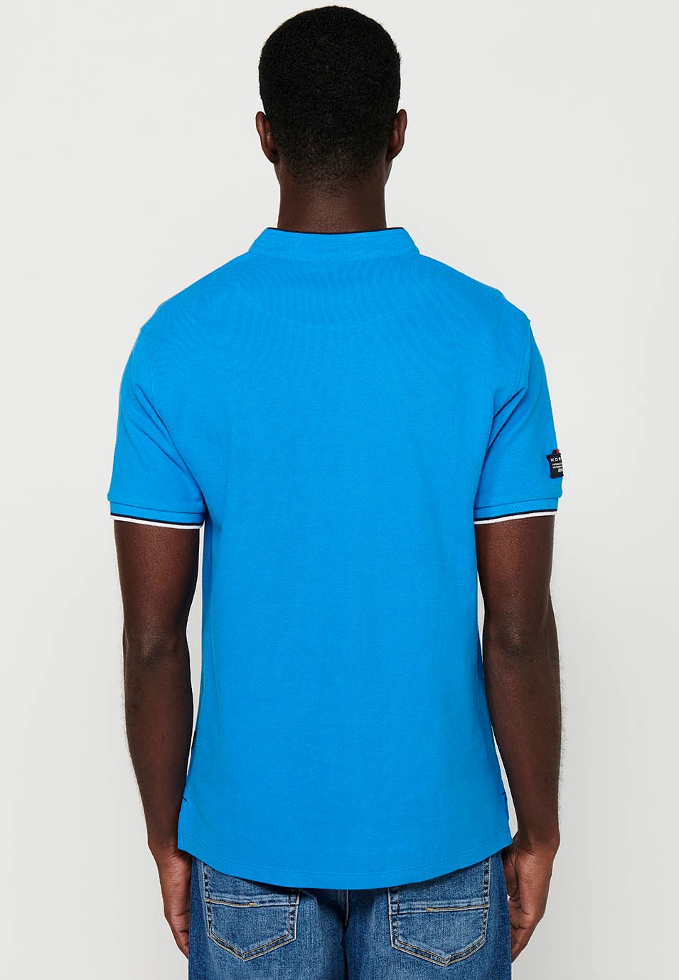 Kurzarm-Poloshirt aus Baumwolle mit geripptem Finish, Rundhalsausschnitt, geknöpfter Öffnung und Seitenschlitzen in Blau für Herren 7