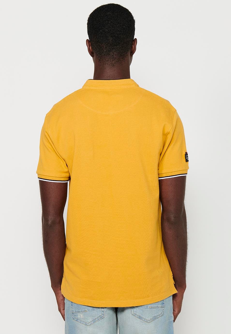 Short-sleeved cotton polo shirt with ribbed finish with round neck with buttoned opening and yellow side slits for men 7