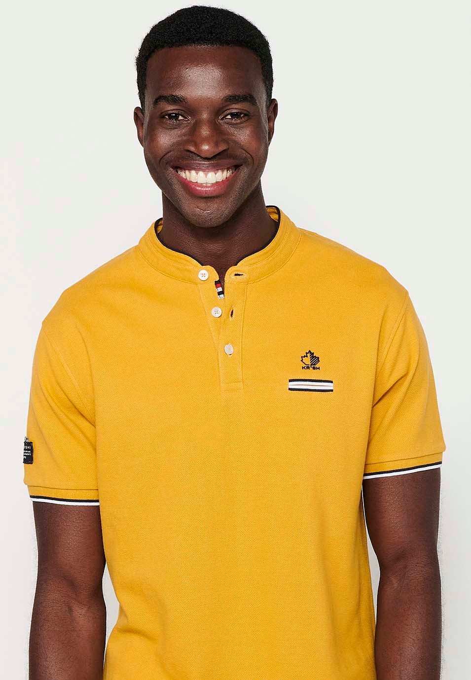 Short-sleeved cotton polo shirt with ribbed finish with round neck with buttoned opening and yellow side slits for men 1